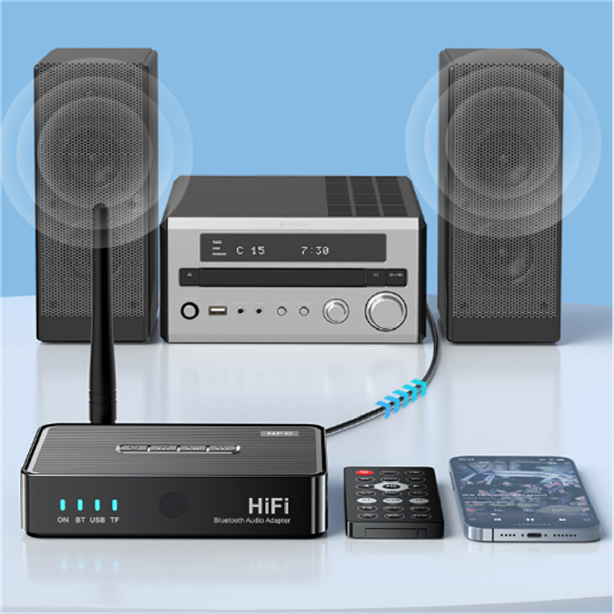 Ein schwarzer HiFi-Audioadapter mit Fernbedienung und Telefon, angeschlossen an Lautsprecher und Stereoanlage.