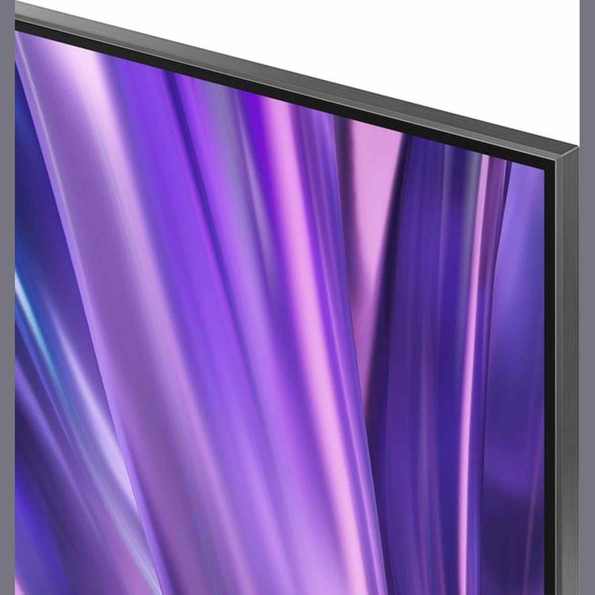 Zbliżenie ekranu TV pokazującego żywe fioletowe i różowe wzory abstrakcyjne.