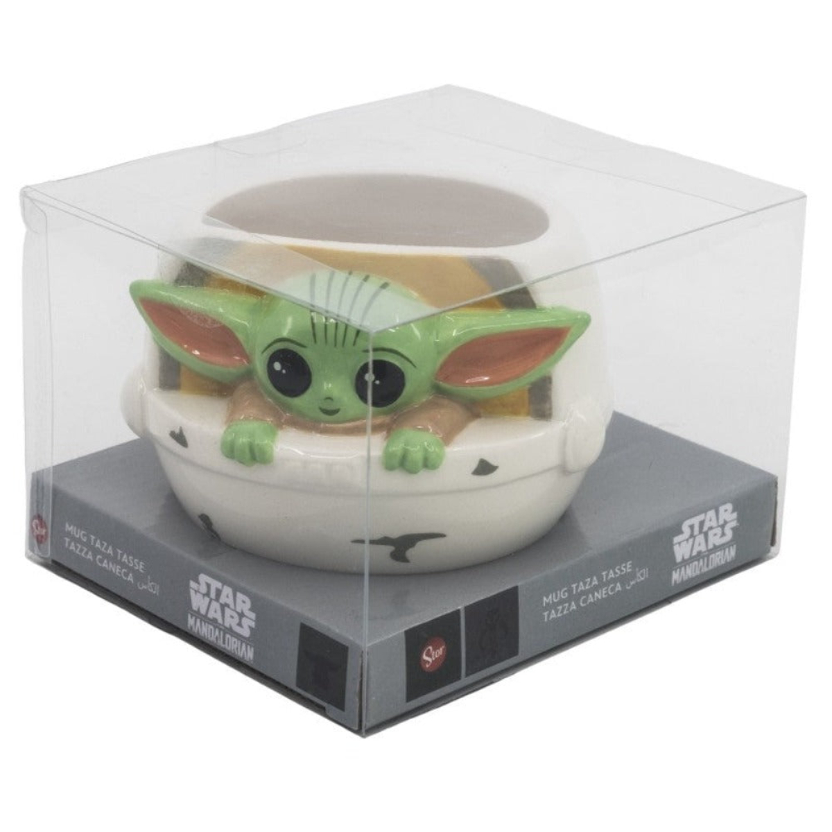 Una taza de Grogu en una caja transparente sobre una caja de Star Wars Mandalorian.