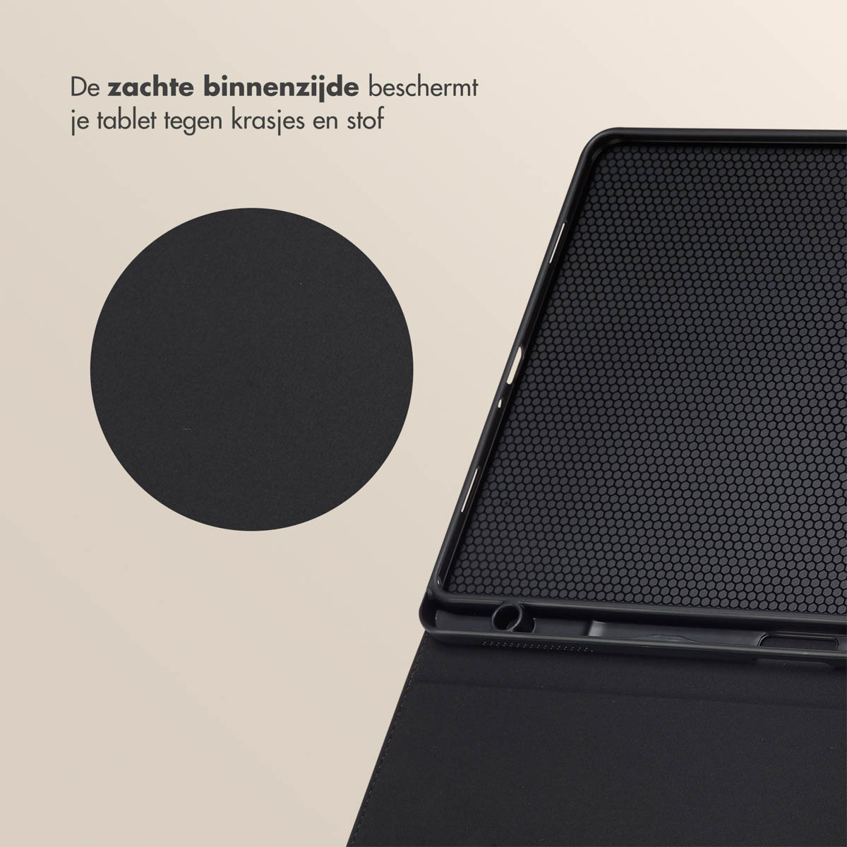 A black tablet case is open, showing a black interior with small holes. A solid black circle is on the left.