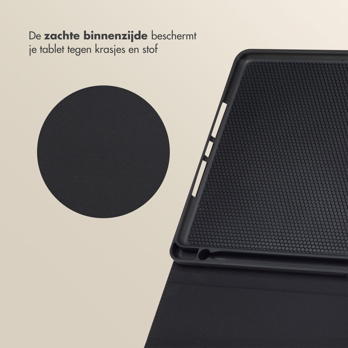 A black tablet case is open, showing a black interior with small holes. A solid black circle is on the left.