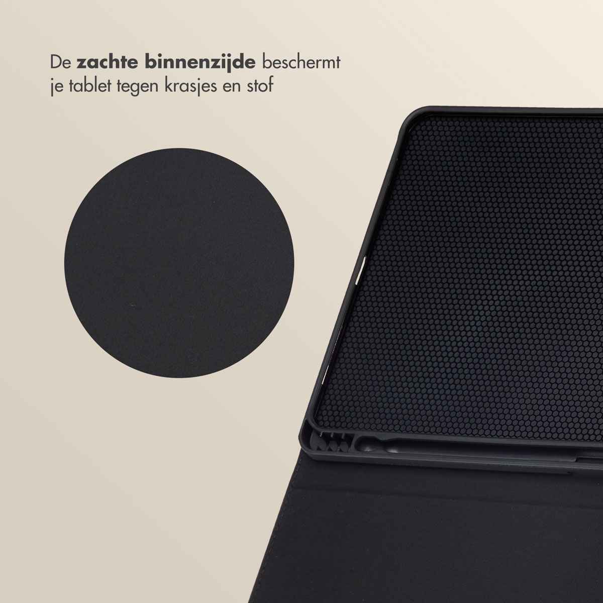 A close up of a black tablet case. The interior of the case is visible. A circular detail is shown.