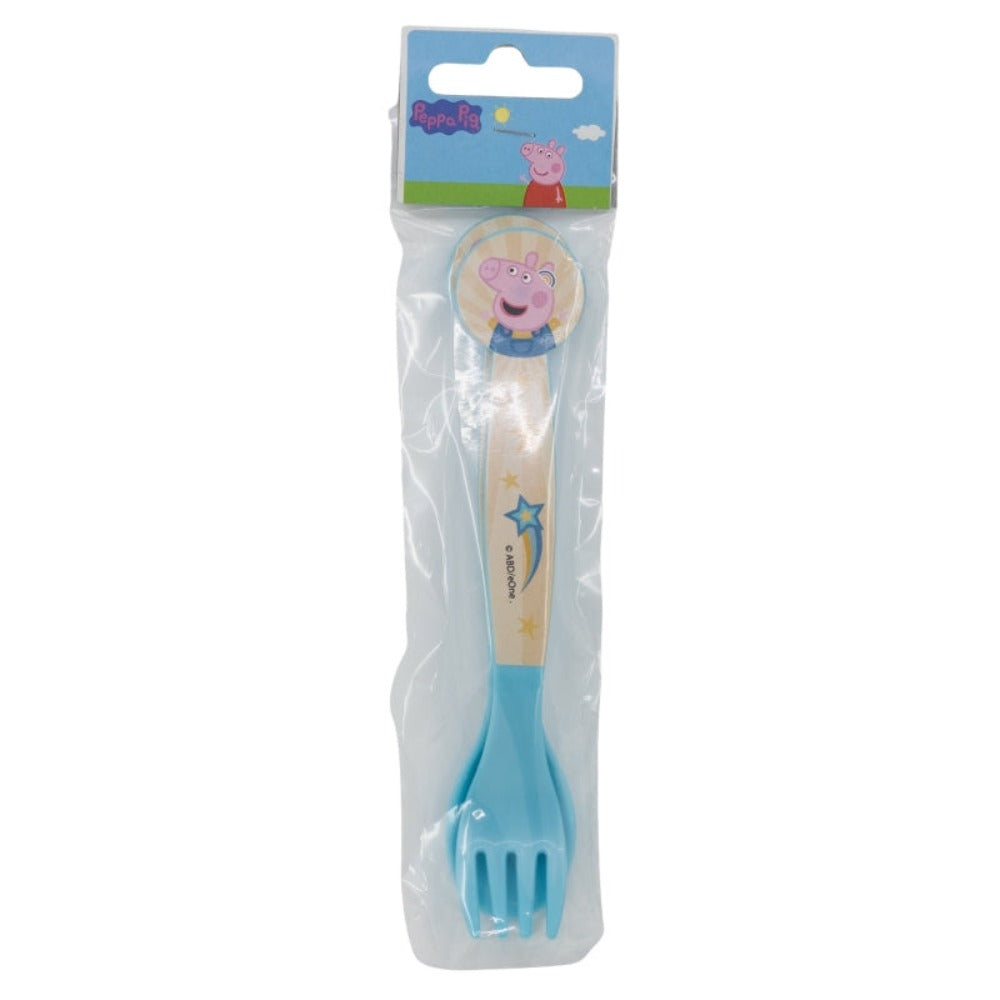 Eine blaue und helle Holzgabel mit Peppa Wutz-Motiv, versiegelt in Kunststoffverpackung.