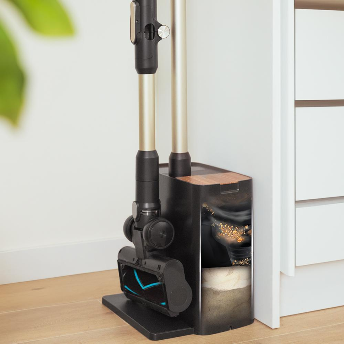 A cordless vacuum cleaner with accessories and a black and gold charging station.