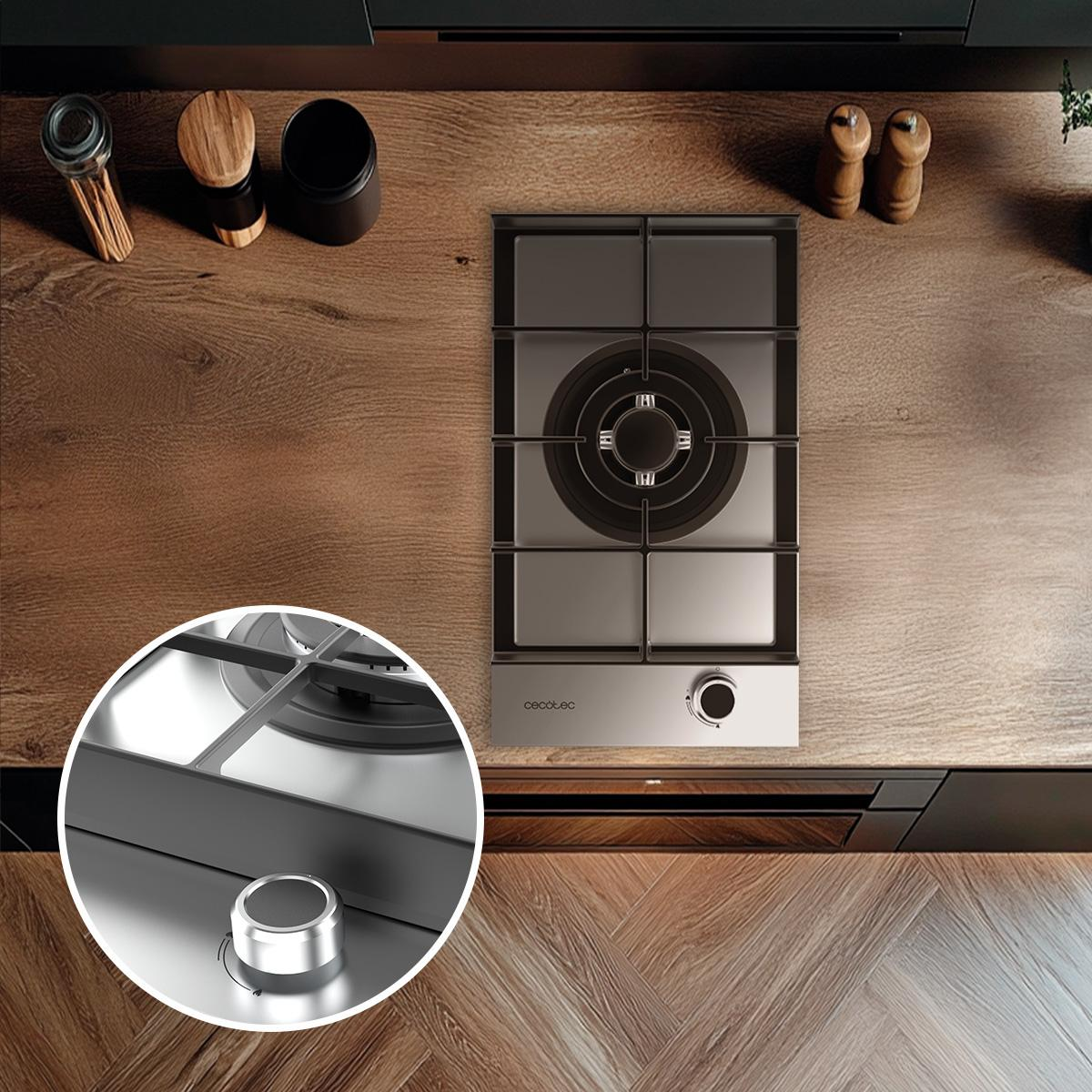 Estufa de gas, vista superior. Encimera de madera. Perilla plateada. Cocina moderna. Primer plano. Electrodoméstico.