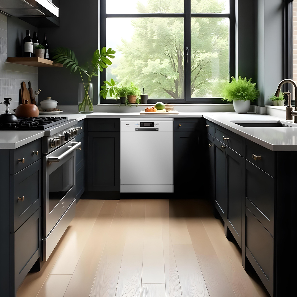 Cocina con gabinetes negros, lavavajillas blanco y una gran ventana con un árbol verde.