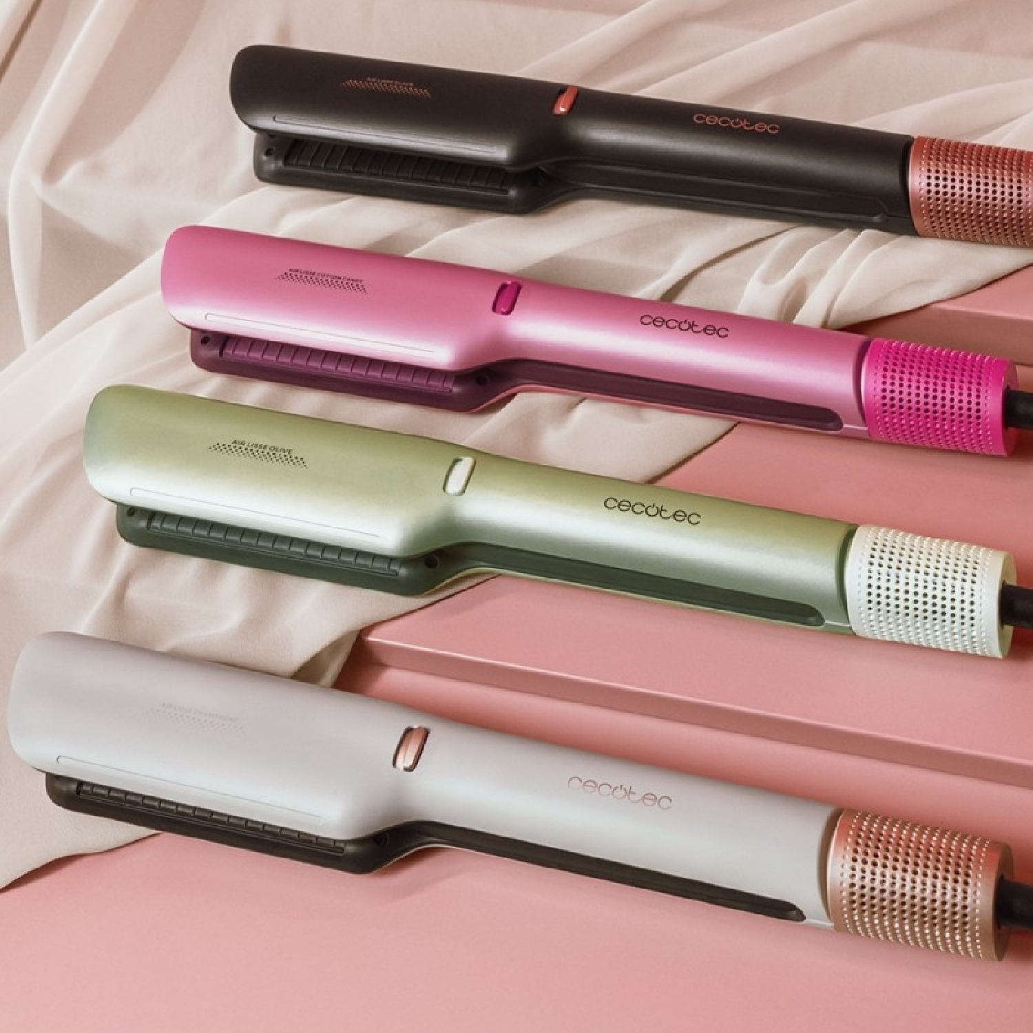 Vier stijltangen in verschillende kleuren: zwart, roze, groen en wit.