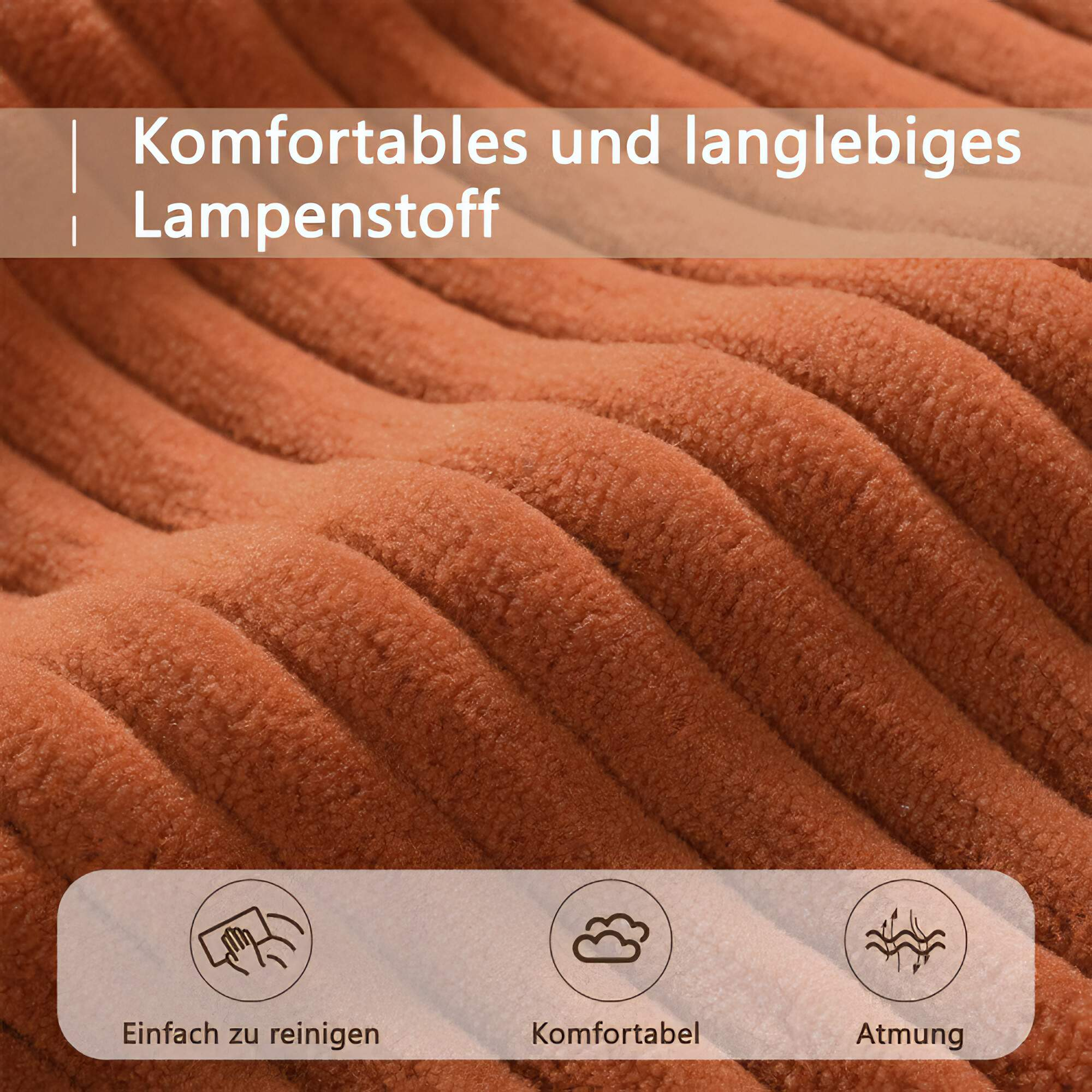 Nahaufnahme von orangefarbenem Cordstoff, mit Text, der besagt, dass er leicht zu reinigen, bequem und atmungsaktiv ist.
