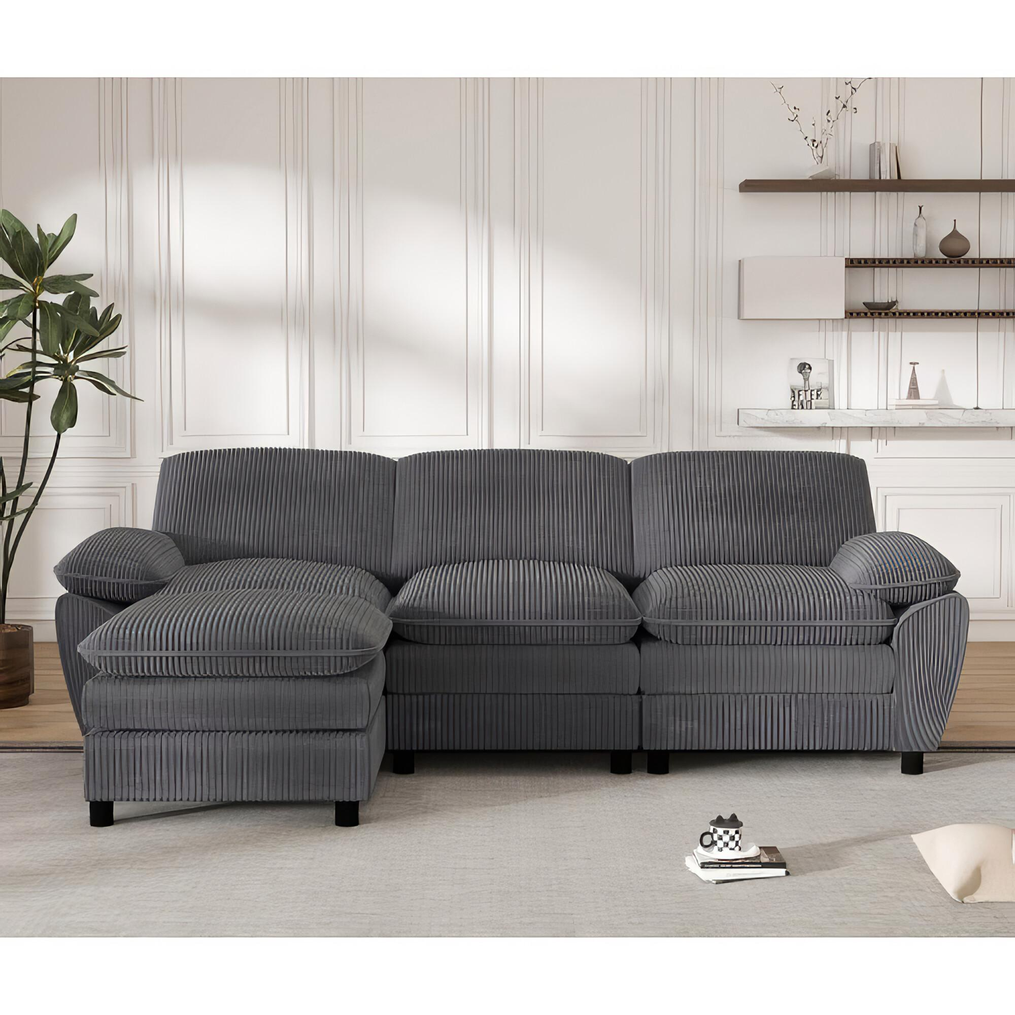 Graues Ecksofa mit Chaiselongue.