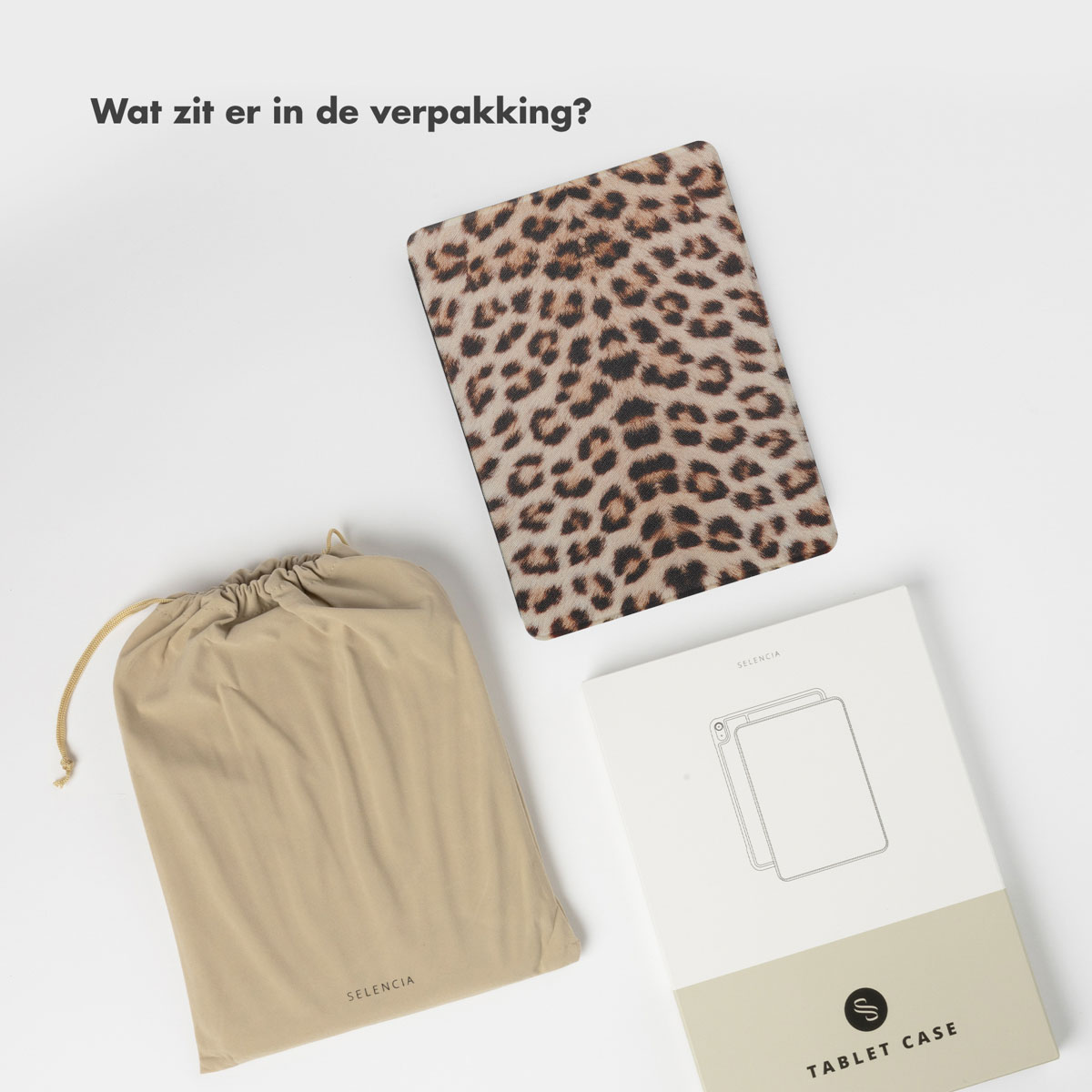 Tablet case, pouch, and box on a white surface. Leopard print on the case.