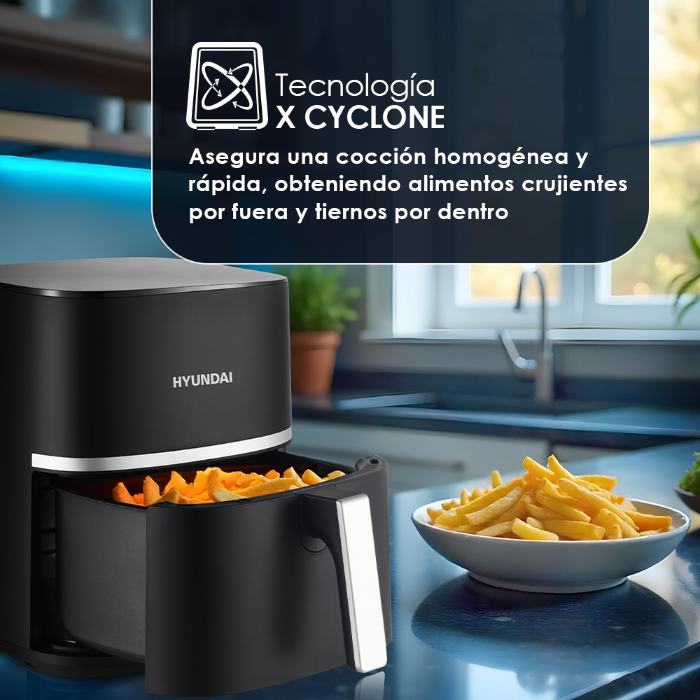 Una freidora de aire negra con papas fritas en la cesta y un tazón. El texto dice: Tecnología X CYCLONE. Alimentos rápidos y crujientes.