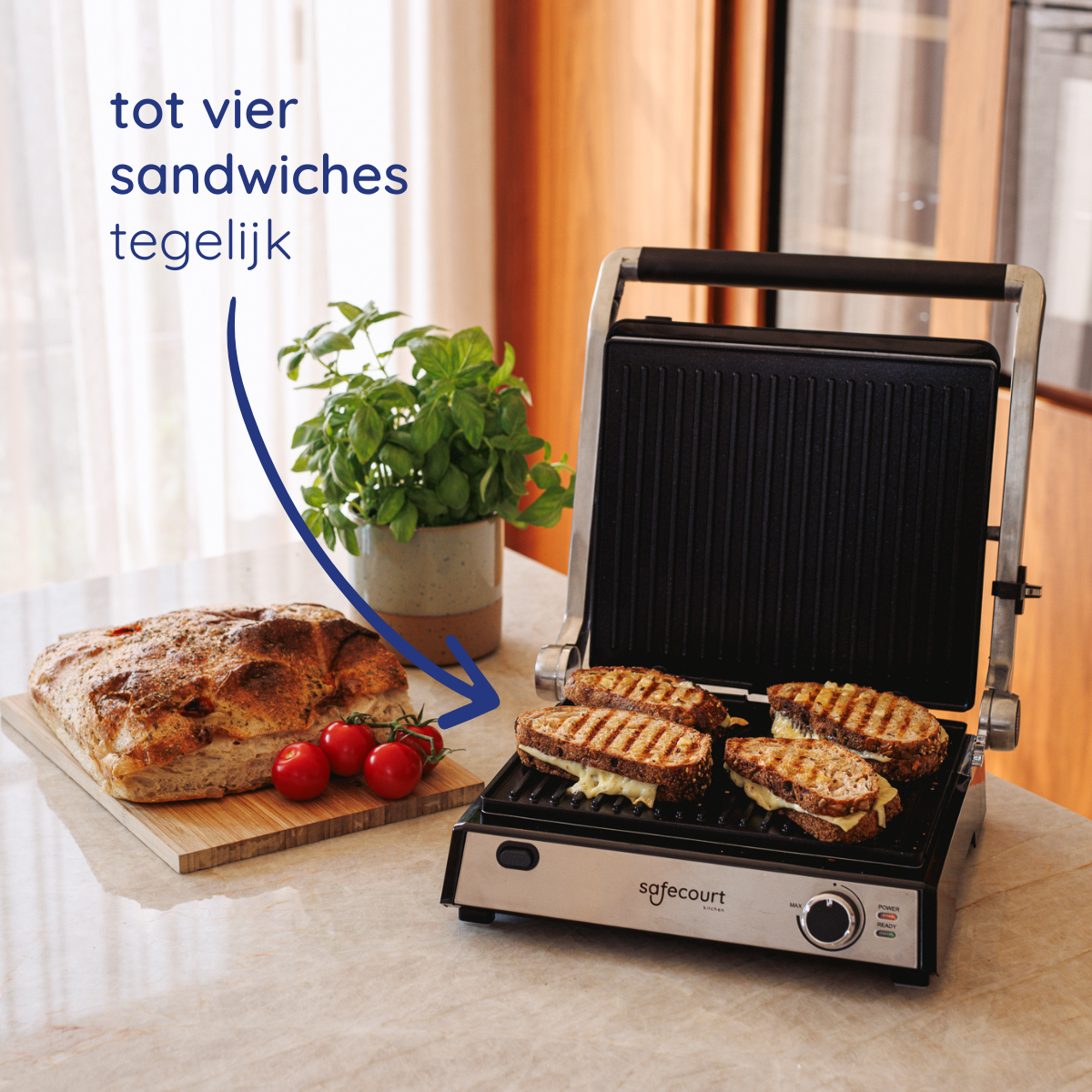 A grill has four sandwiches cooking. Bread, tomatoes, and a plant are on the counter. An arrow points to the bread.