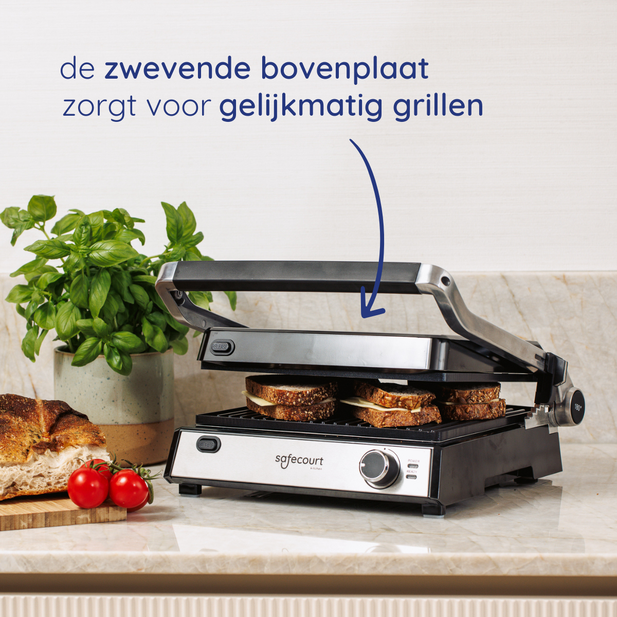 A grill has sandwiches cooking. Bread, tomatoes, and a plant are on the counter. Text says that the grill ensures even cooking.