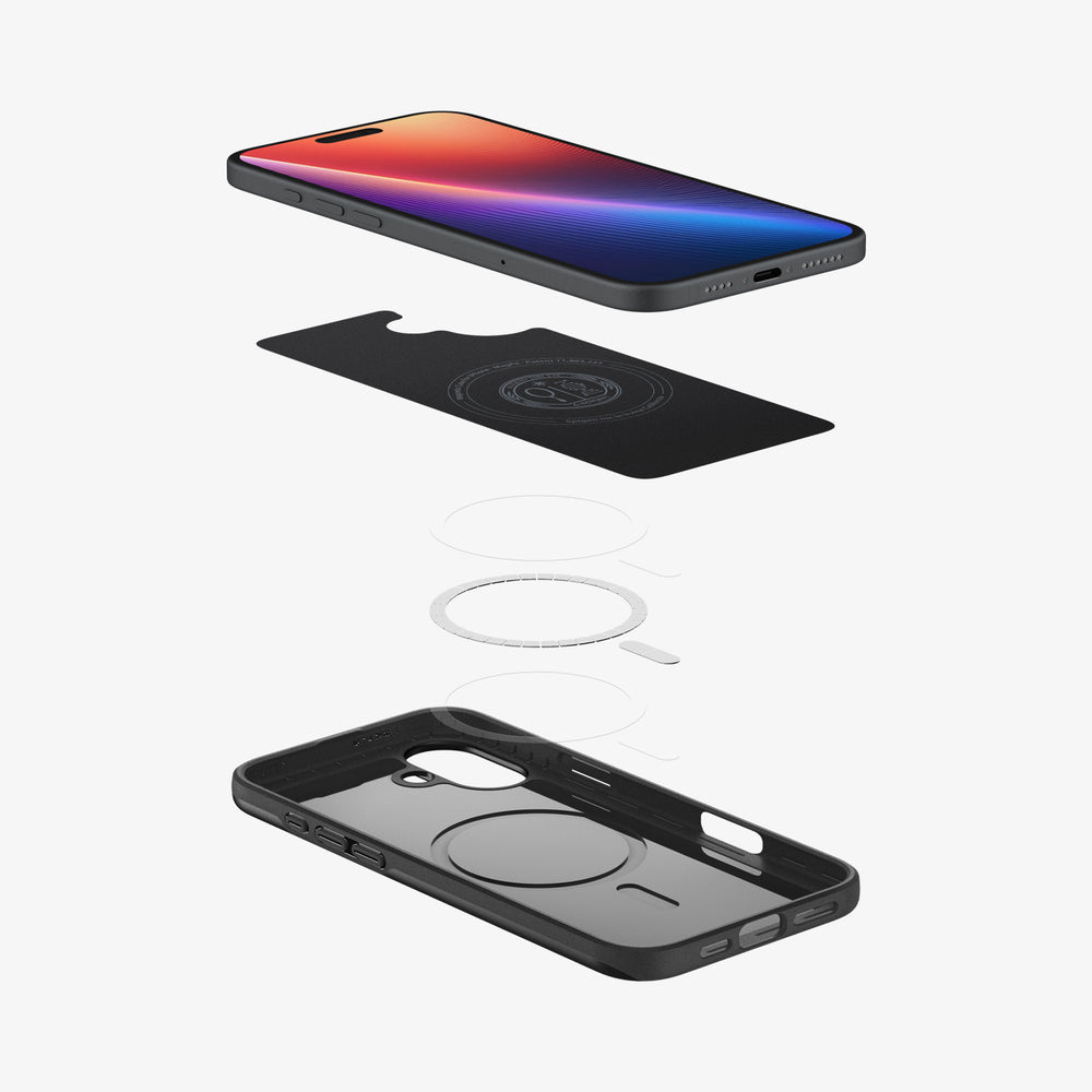 Telefon, etui i element magnetyczny w widoku rozłożonym. Czarna obudowa, telefon z kolorowym wyświetlaczem.