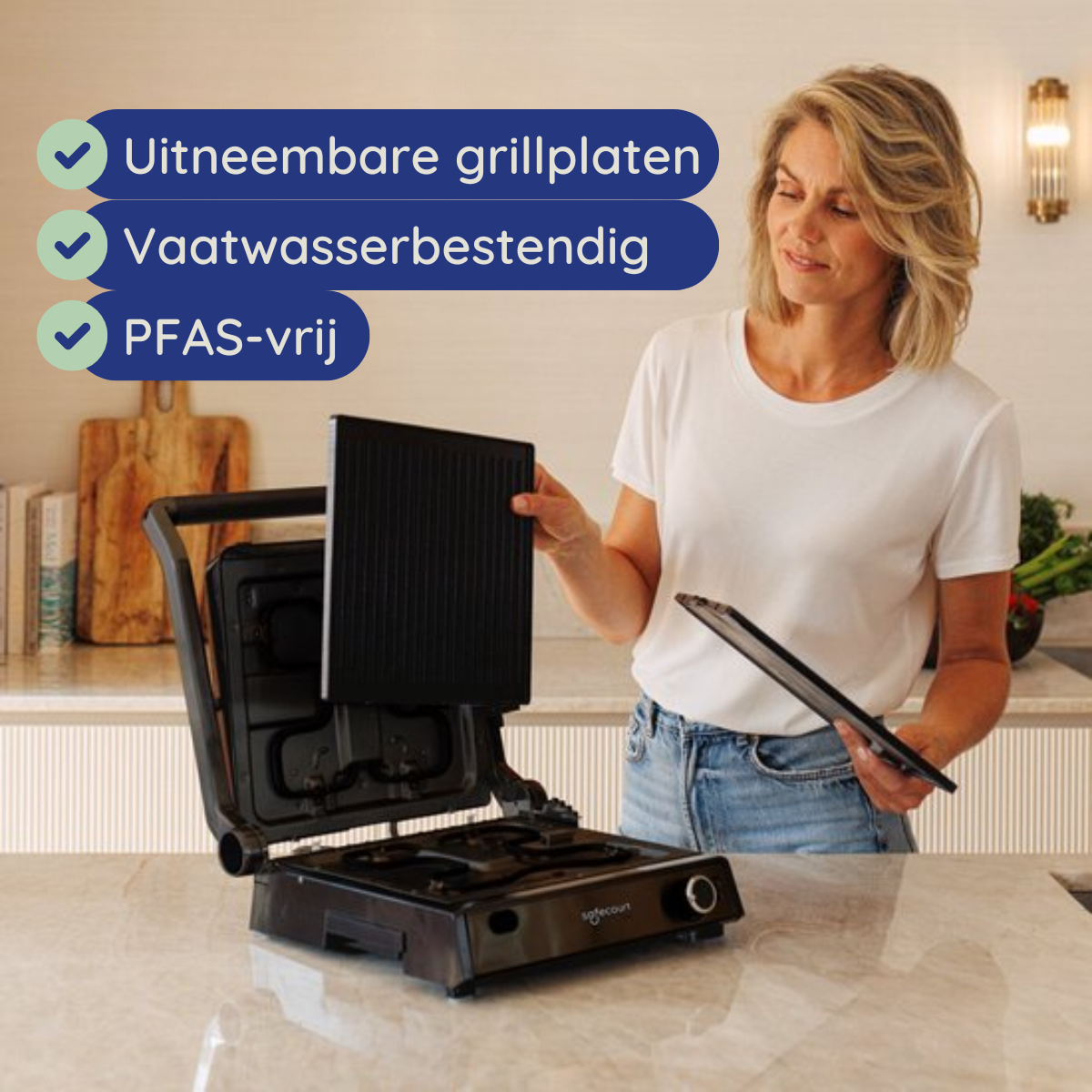 A woman removes a grill plate from a black grill. Text highlights features. Kitchen setting.