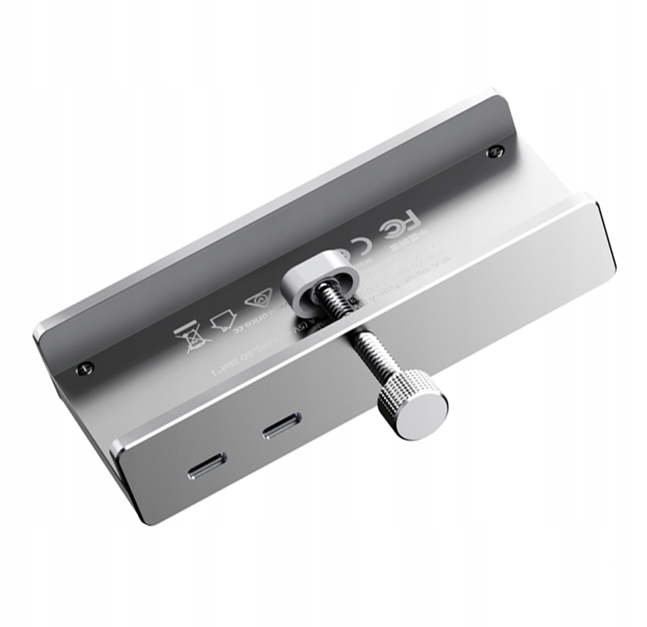 Srebrne metalowe urządzenie z wieloma portami i śrubą do regulacji położenia.