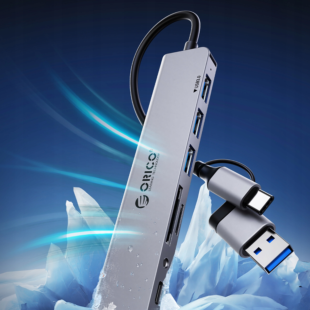 Srebrny hub USB z wieloma portami i złączami USB-C. Niebieski efekt świetlny.