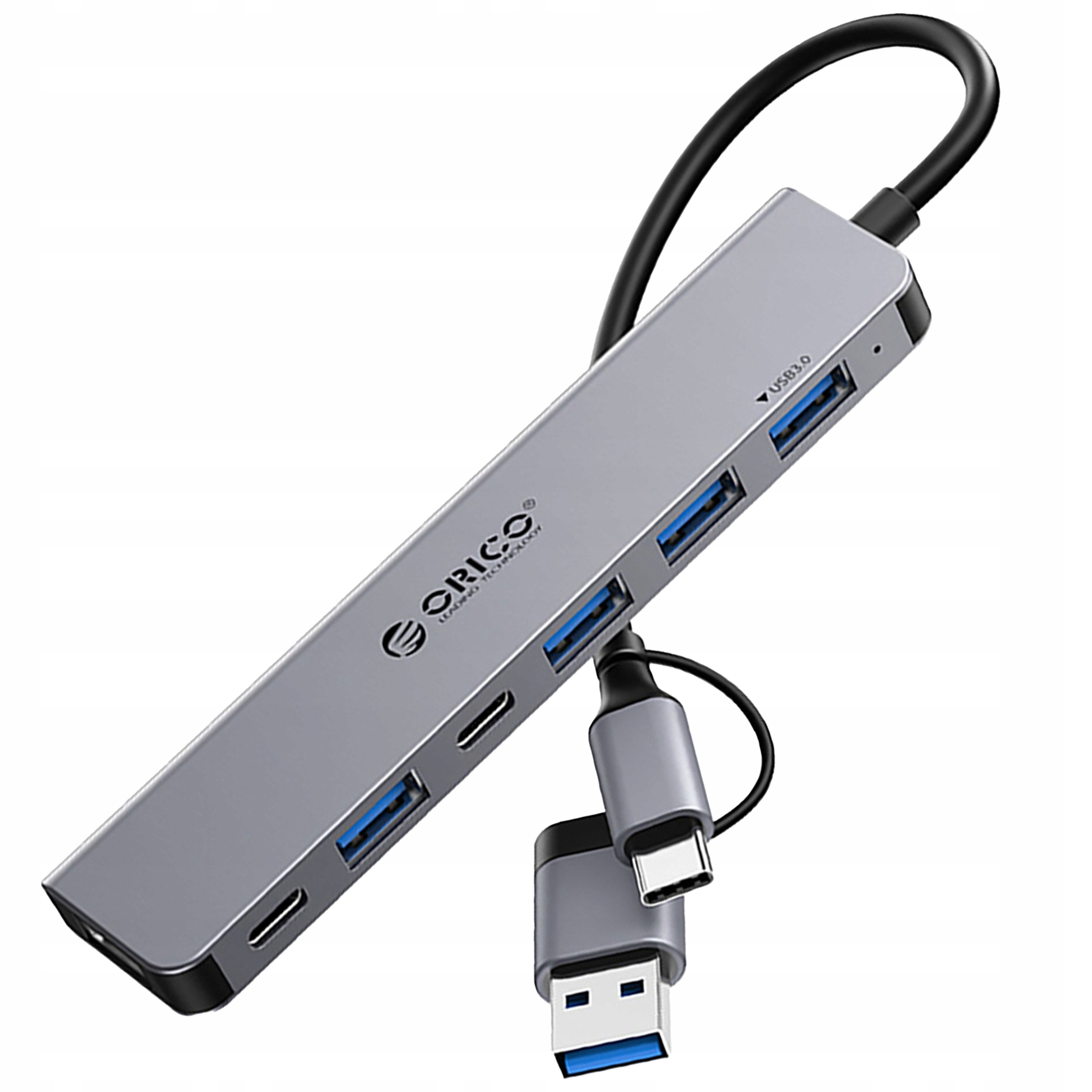 Srebrny hub USB z wieloma portami i złączami USB-C. Ciemne tło.