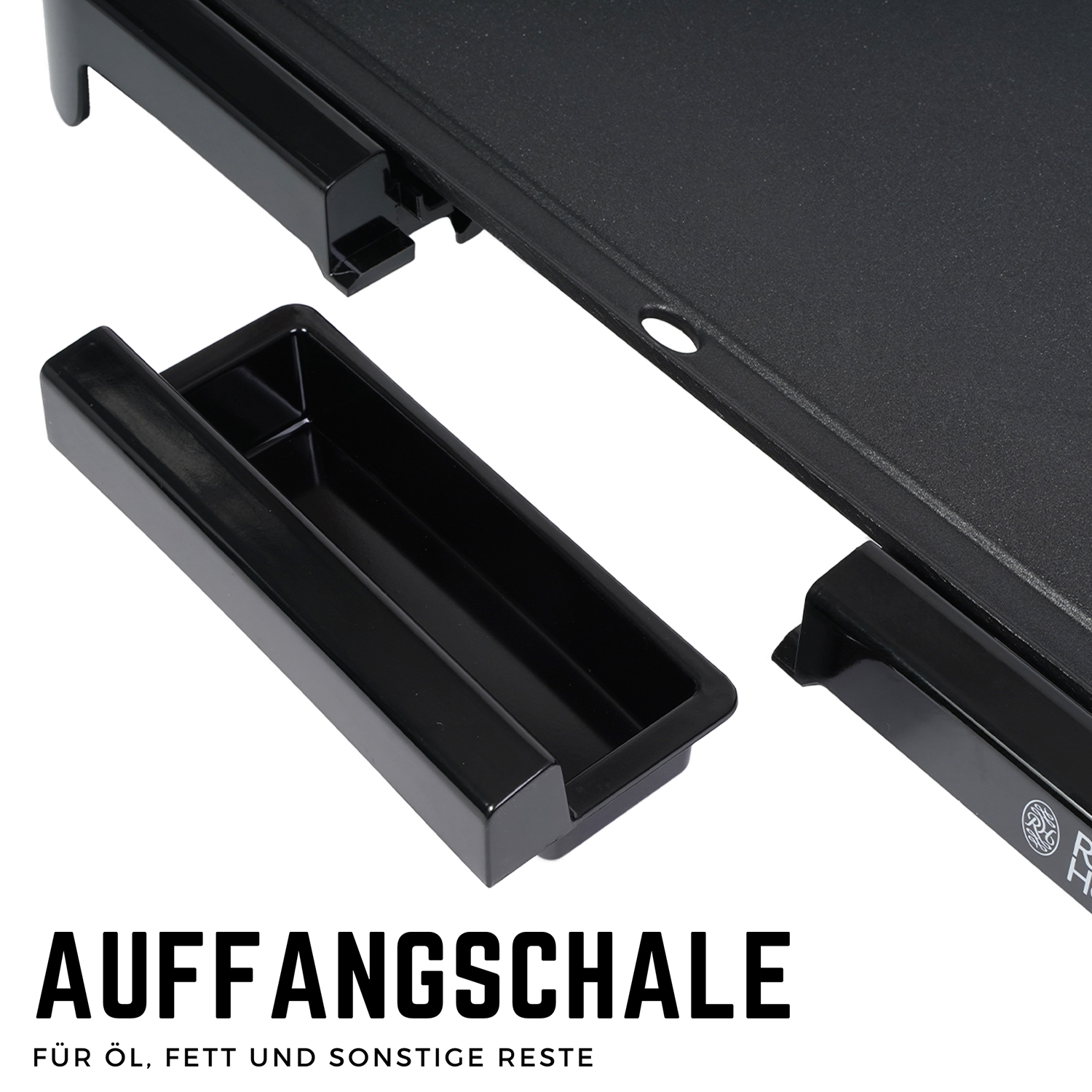 Schwarze Schale mit Text 'AUFFANGSCHALE' und darunter. Teil eines schwarzen Grills.