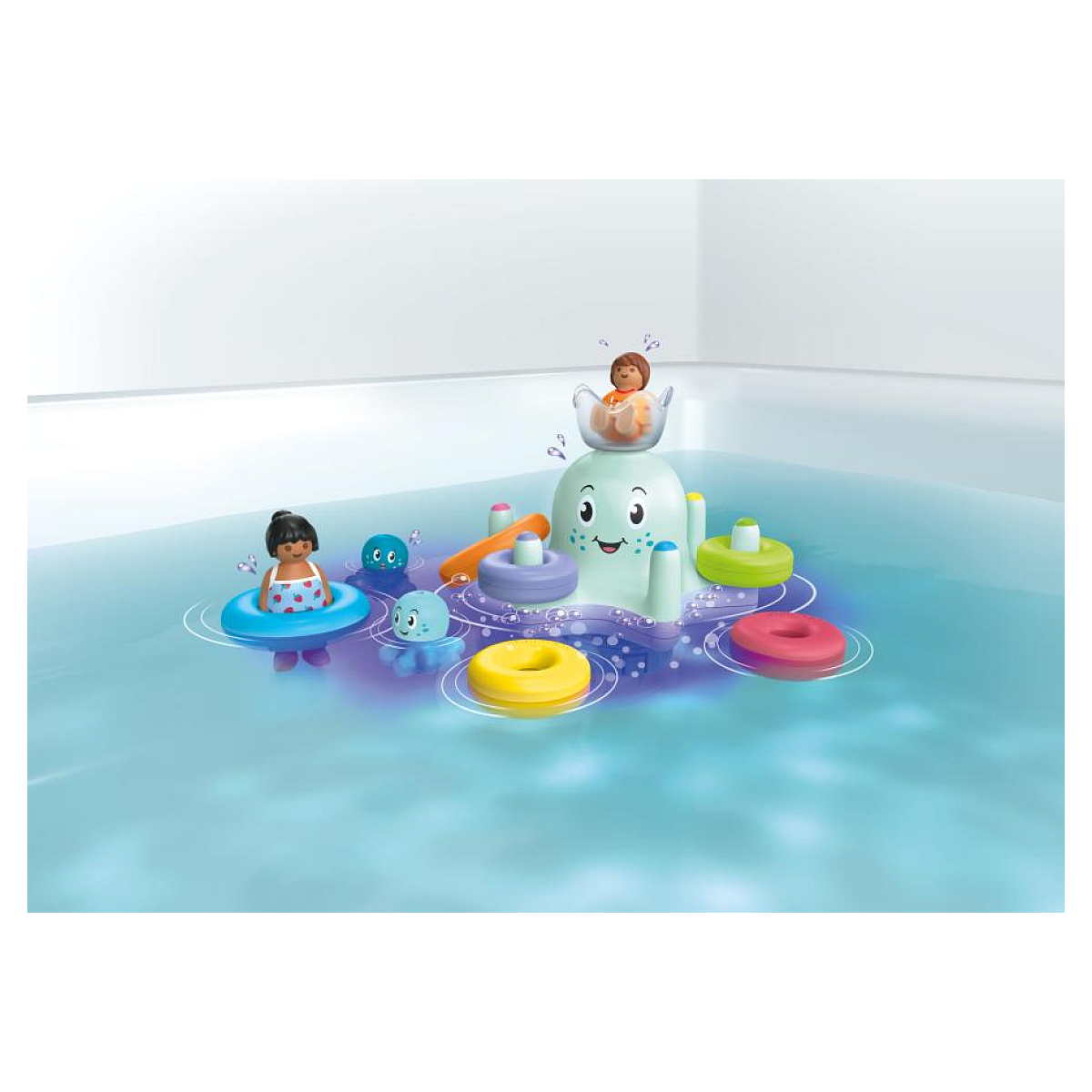 Zestaw Playmobil Aqua. Scena przedstawia zabawkę w kształcie ośmiornicy w wodzie, z figurkami i pływającymi pierścieniami.