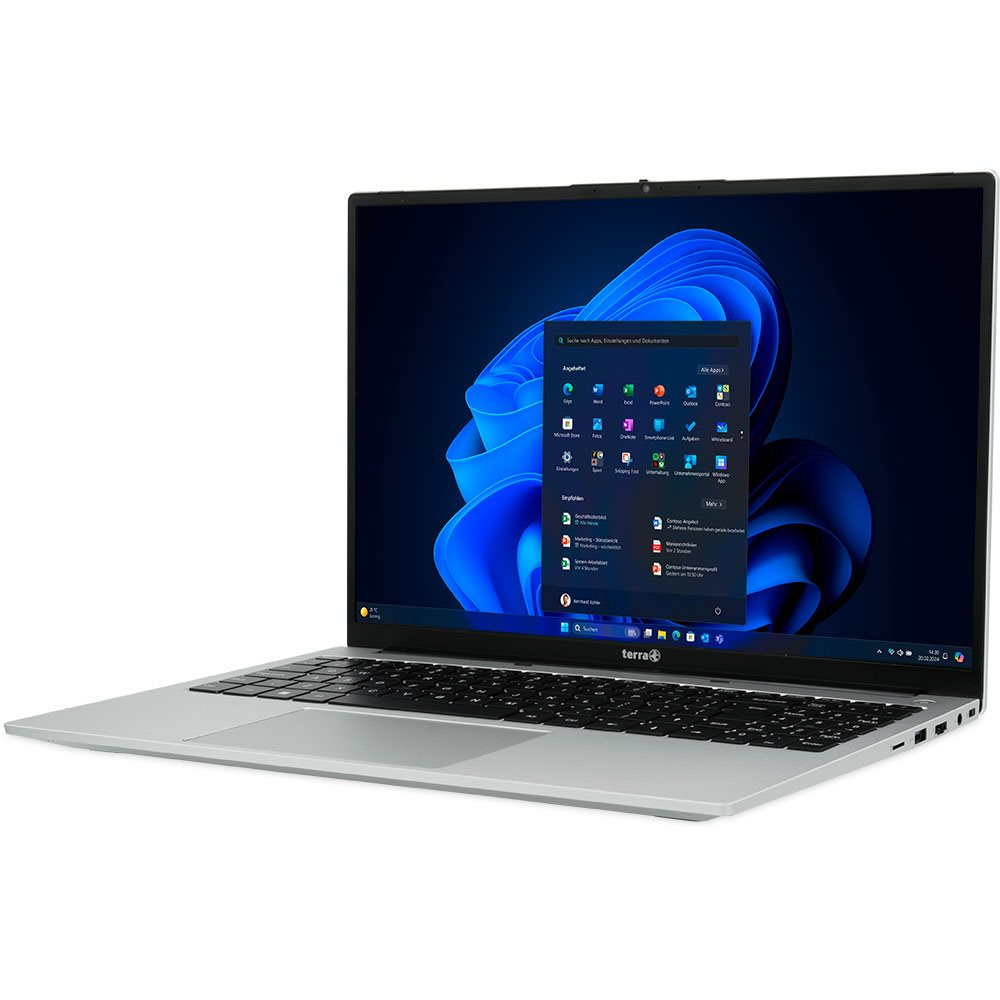 Srebrny laptop otwarty z interfejsem Windows. Klawiatura na dole, ekran z aplikacjami.