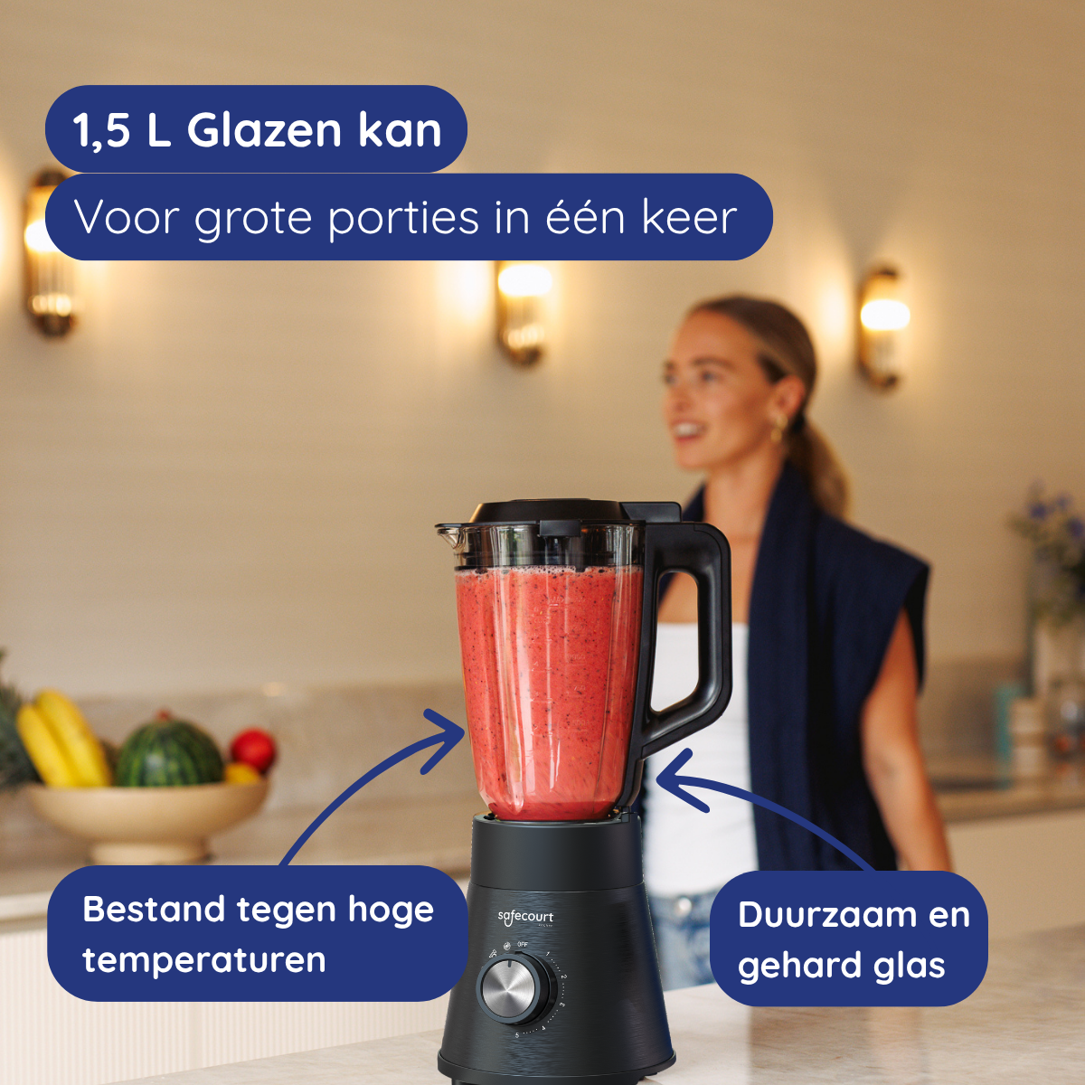 A blender with red liquid inside, and a woman in the background. Text says '1.5 L Glass jar'.