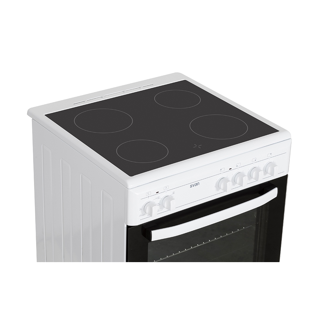Horno blanco con zonas de cocción negras. Panel de control y perillas visibles. Puerta del horno cerrada. Fondo blanco.