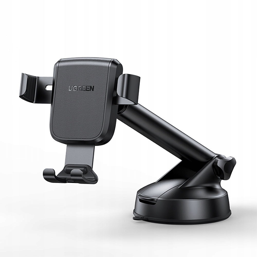 Soporte para teléfono de coche UGREEN negro, montado sobre una superficie, con base de ventosa.