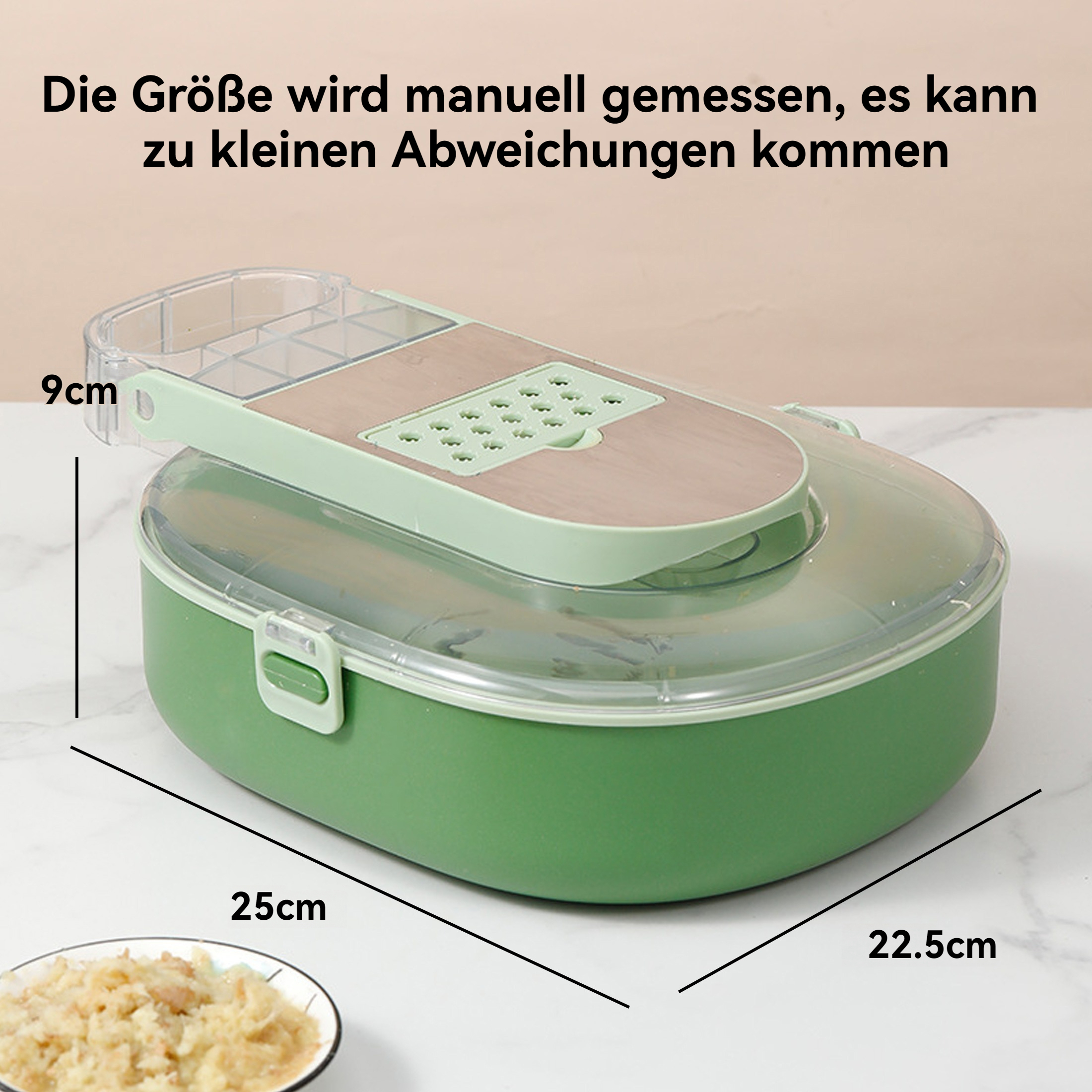 Ein grüner Lebensmittelschneider mit Abmessungen wird gezeigt. Der Schneider befindet sich auf einer weißen Oberfläche.