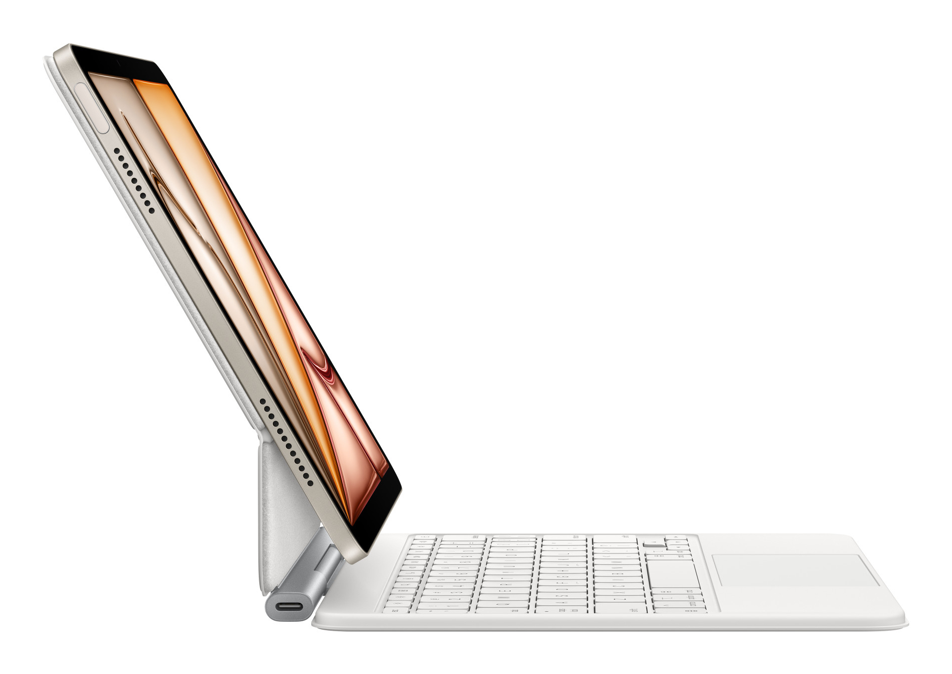 Un tablet bianco con tastiera e trackpad collegati, leggermente angolato.