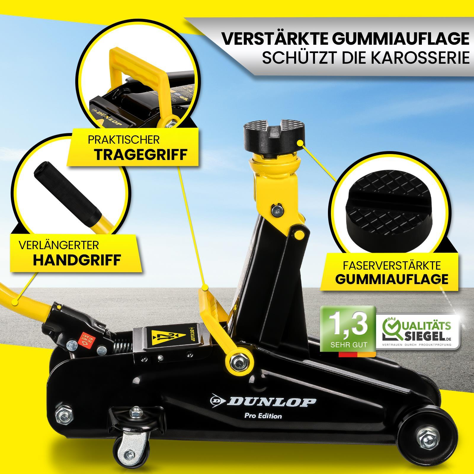 Schwarzer und gelber Wagenheber mit Griff und Gummisockel.