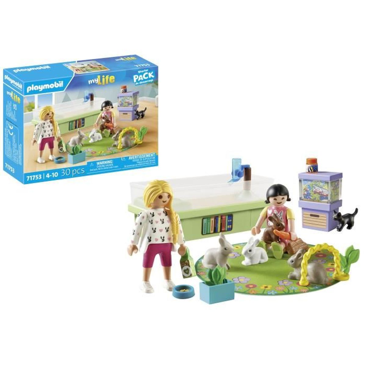 Dwoje dzieci bawiących się zabawkami królikami i kotem w zestawie do zabawy w sklepie zoologicznym Playmobil, z pudełkiem po lewej.