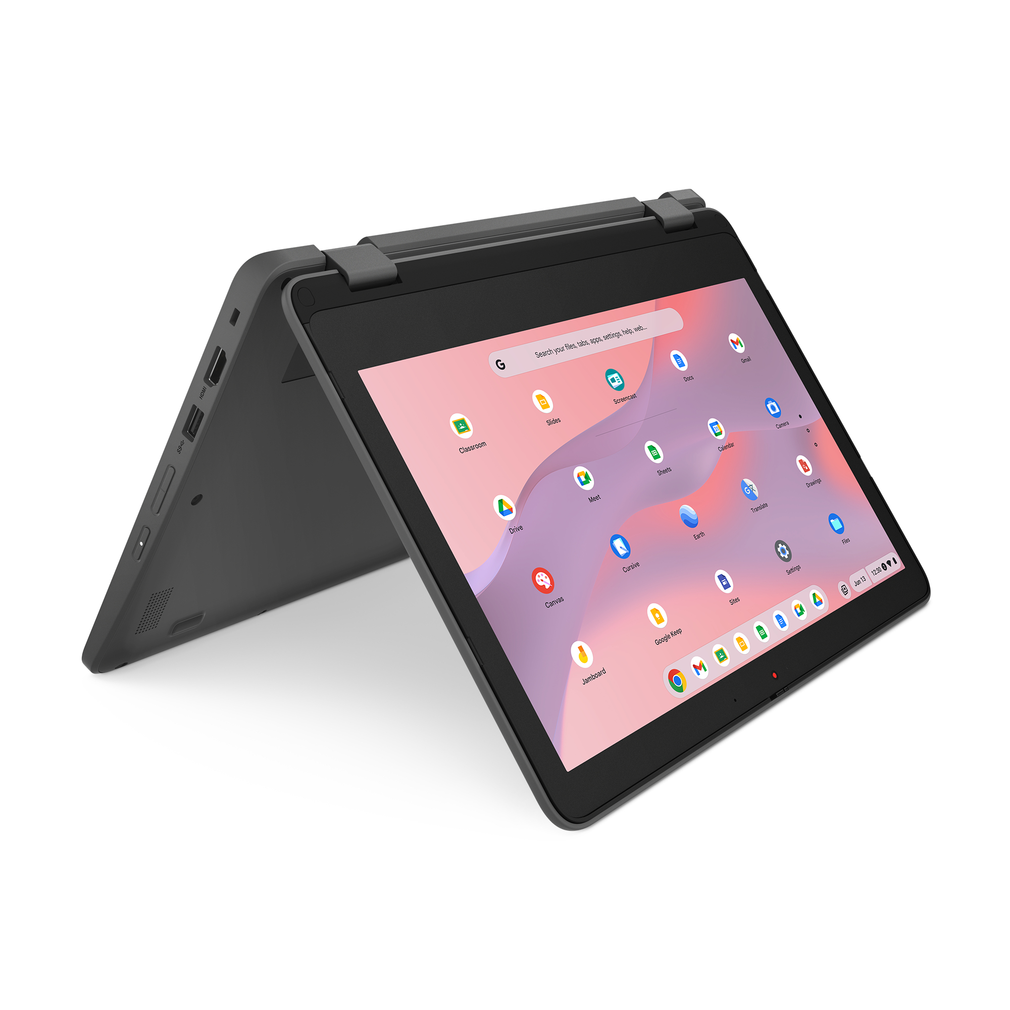 Czarny laptop otwarty, ekran z ikonami aplikacji. Ciemnoszara podstawa. Białe tło.