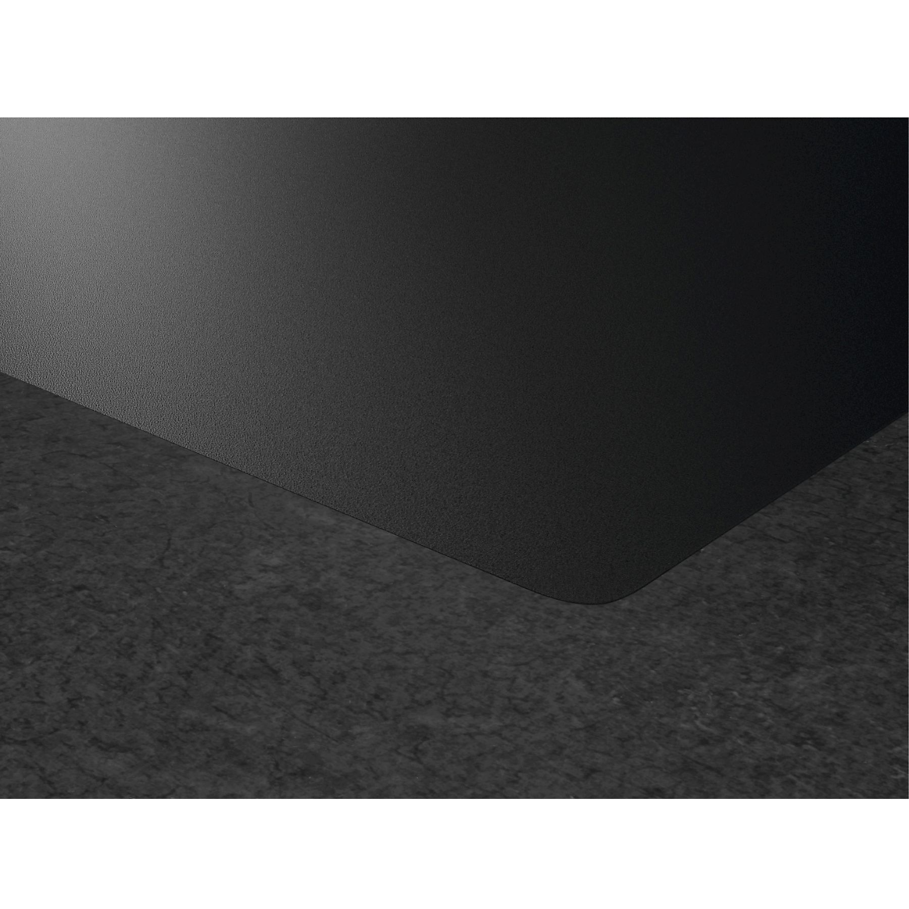 Czarna powierzchnia z teksturowanym wzorem, przylegająca do szarej, teksturowanej powierzchni. Tekstury są szorstkie.