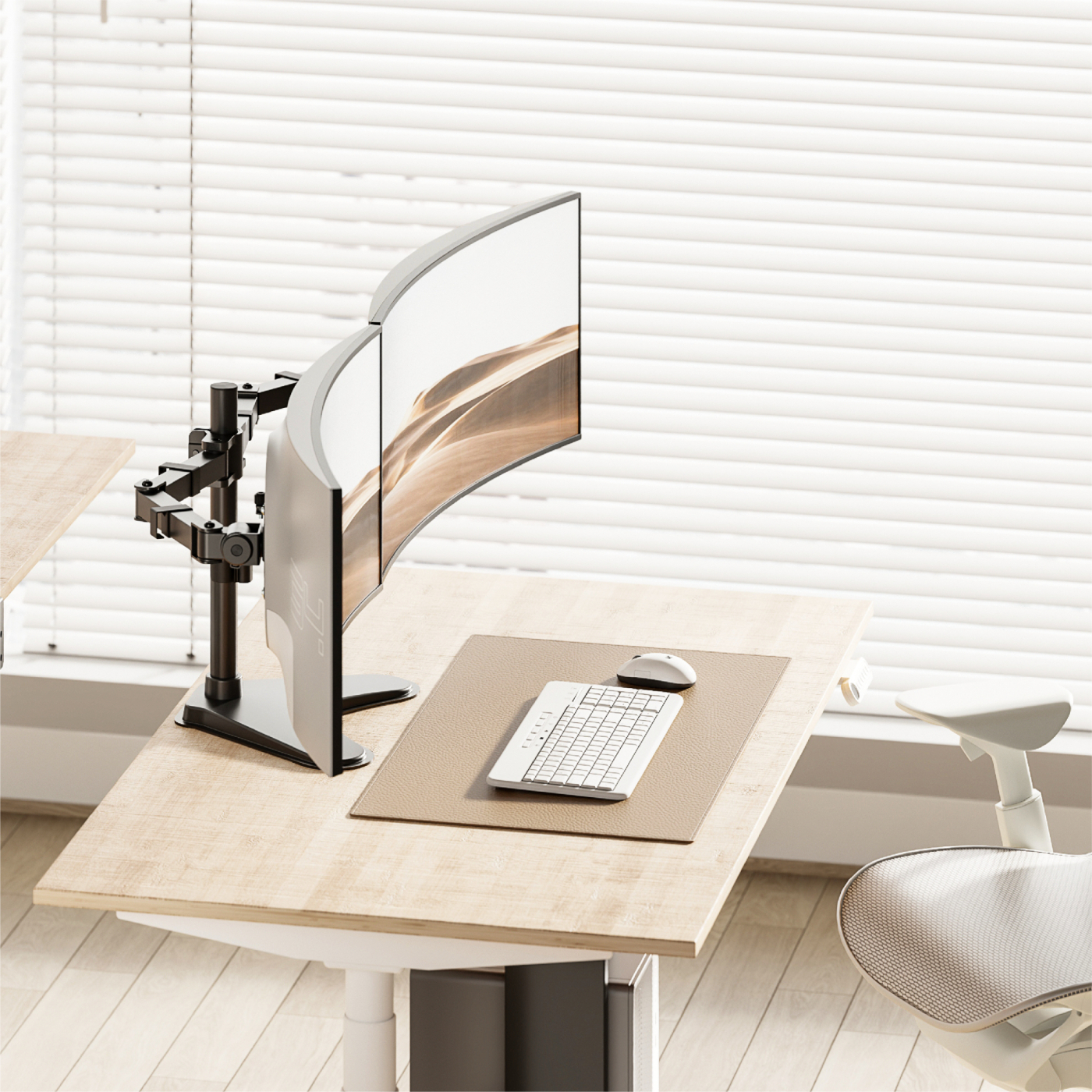 A curved monitor mounted on a black arm, keyboard, mouse, and desk. Blinds in the background.