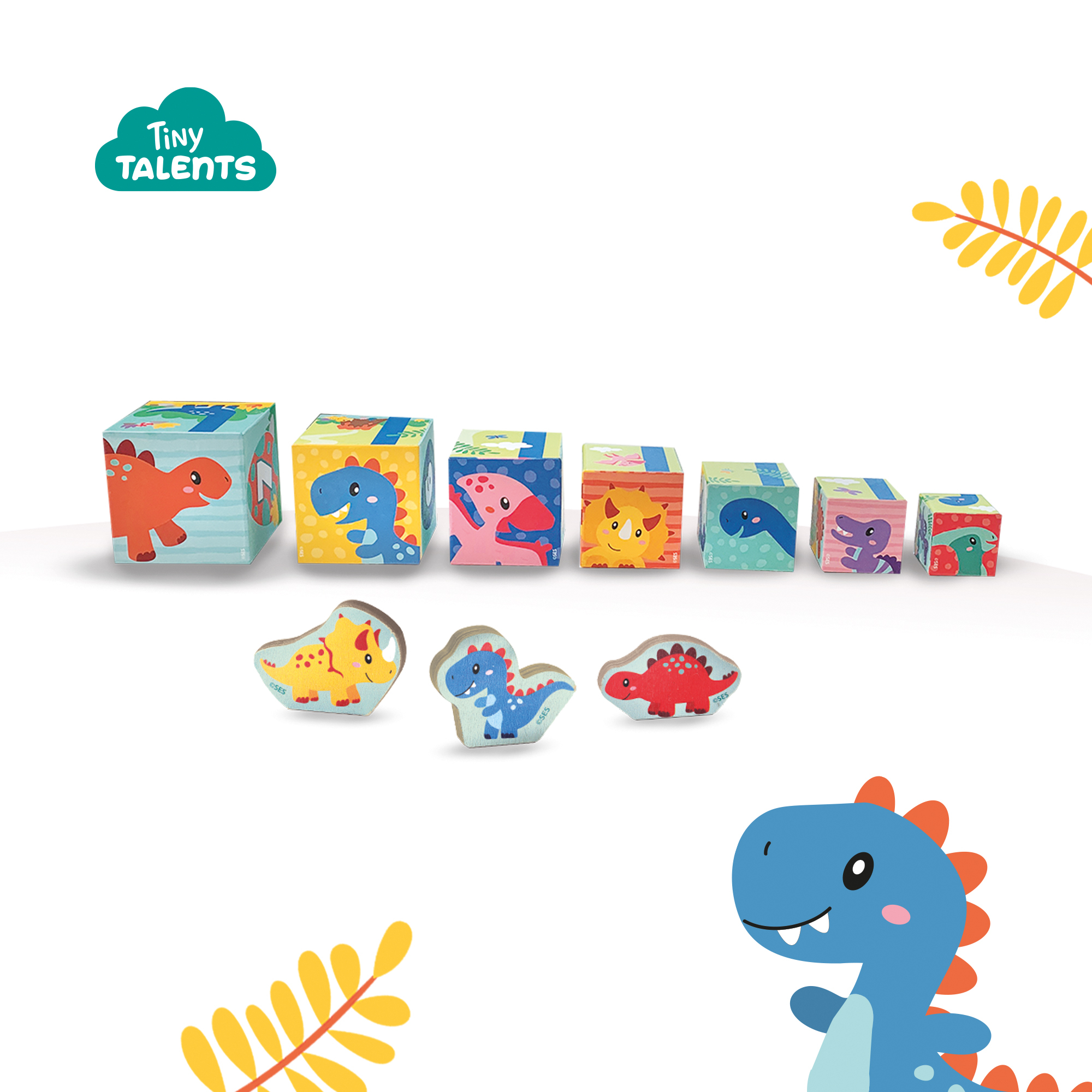 Bloques y figuras coloridas con temática de dinosaurios, con un dinosaurio azul a la derecha.