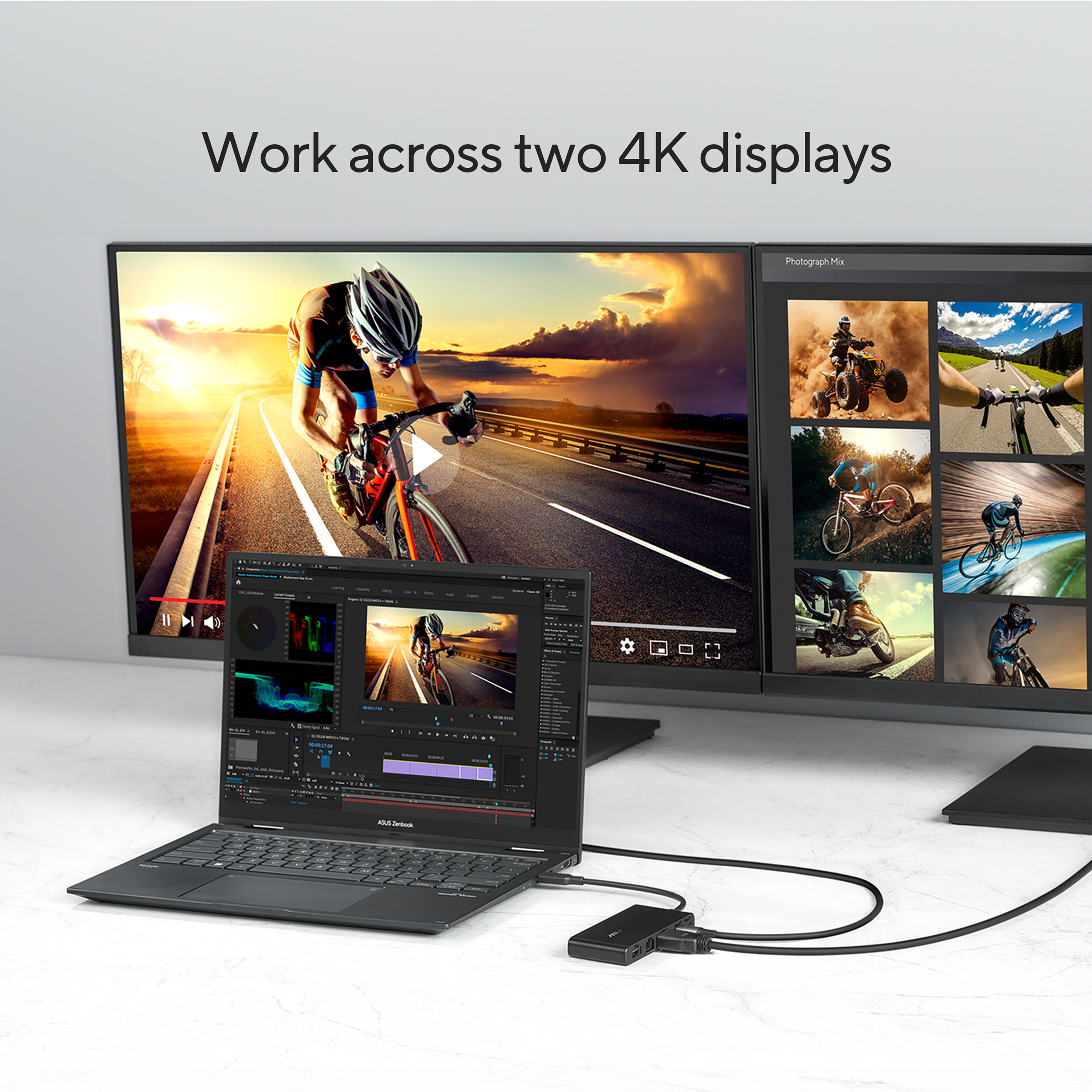 Laptop, monitor, and a second monitor. The screen displays a video editing program.
