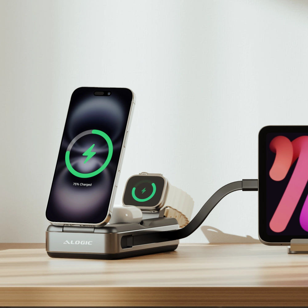 Estación de carga con teléfono, reloj y auriculares; tableta a la derecha. Teléfono muestra 75% cargado.