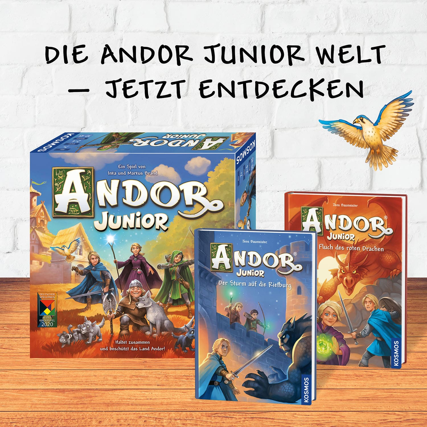 Brettspielboxen von Andor Junior. Es gibt drei Boxen mit Illustrationen von Rittern und einem Drachen und Text auf Deutsch.