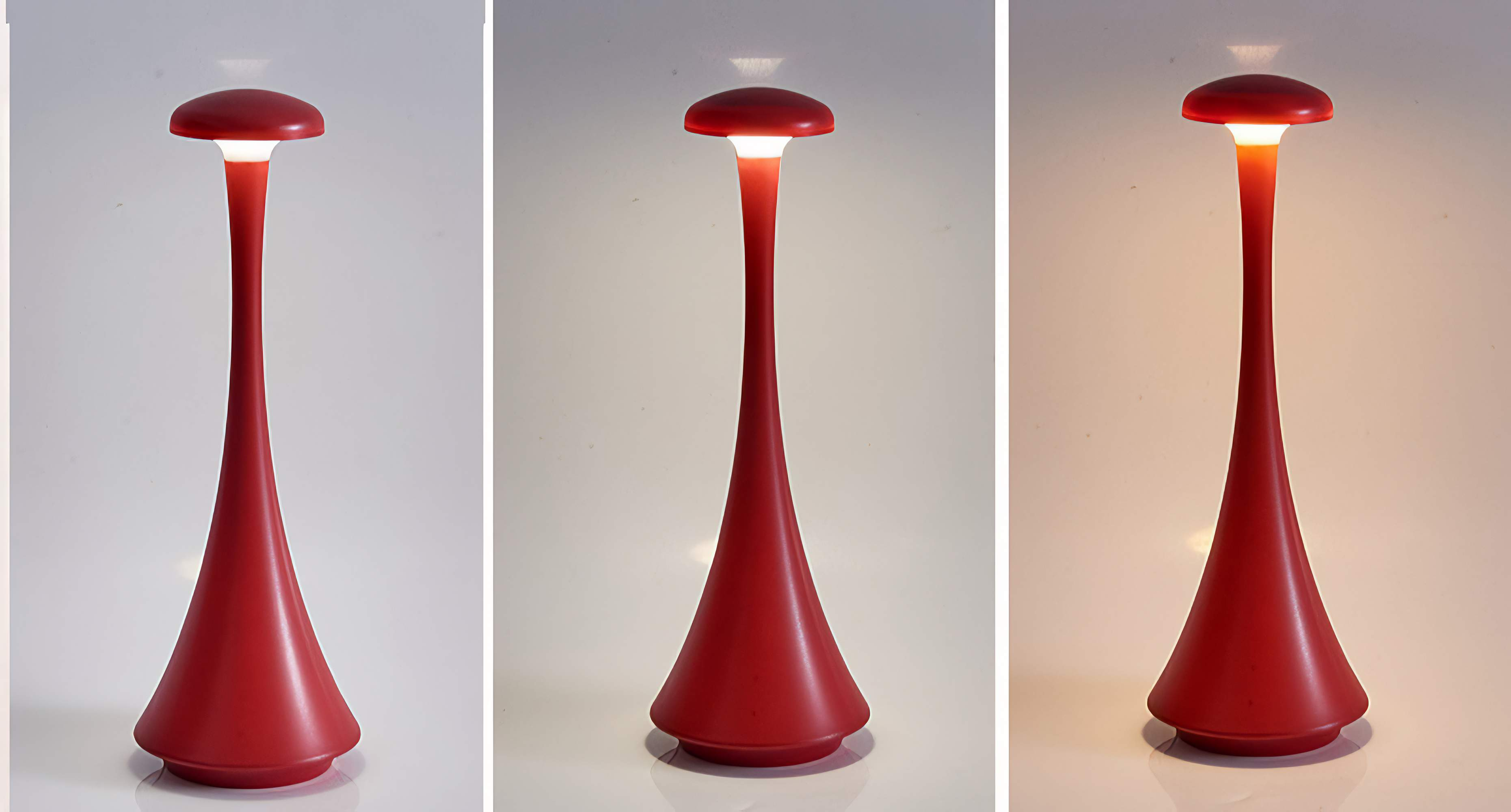 Drei rote Lampen mit unterschiedlichen Lichteinstellungen: weiß, rot und orange, auf weißer Oberfläche.