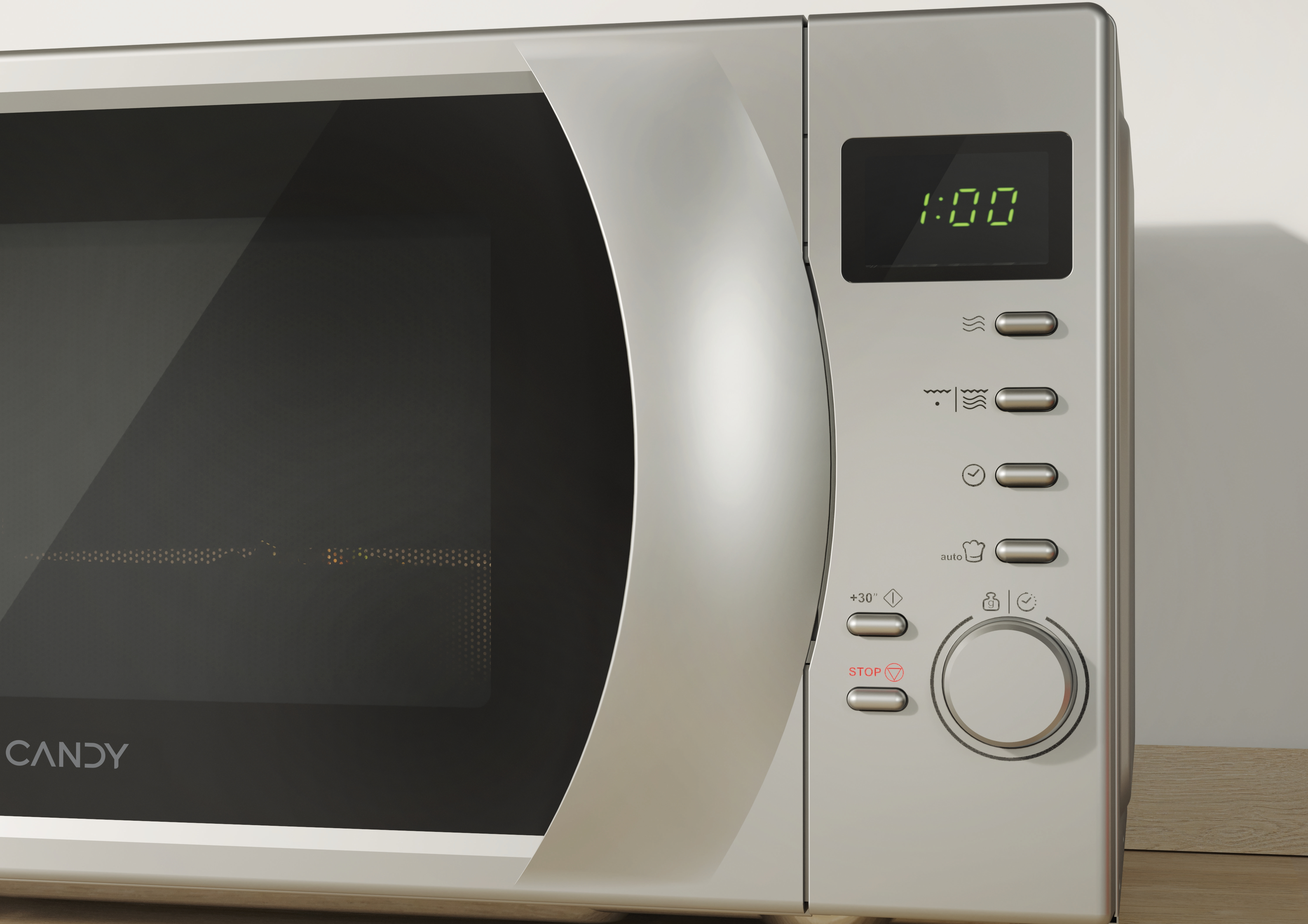 Forno a microonde argentato con display digitale. Pannello di controllo a destra. Marchio Candy.
