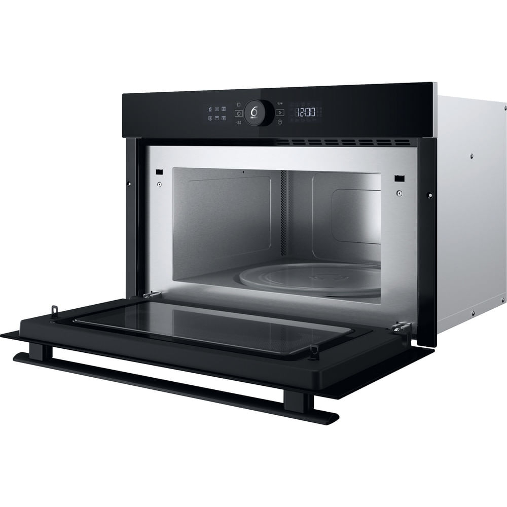 Microondas Whirlpool con puerta abierta, revelando el interior. El reloj digital muestra las 12:00.