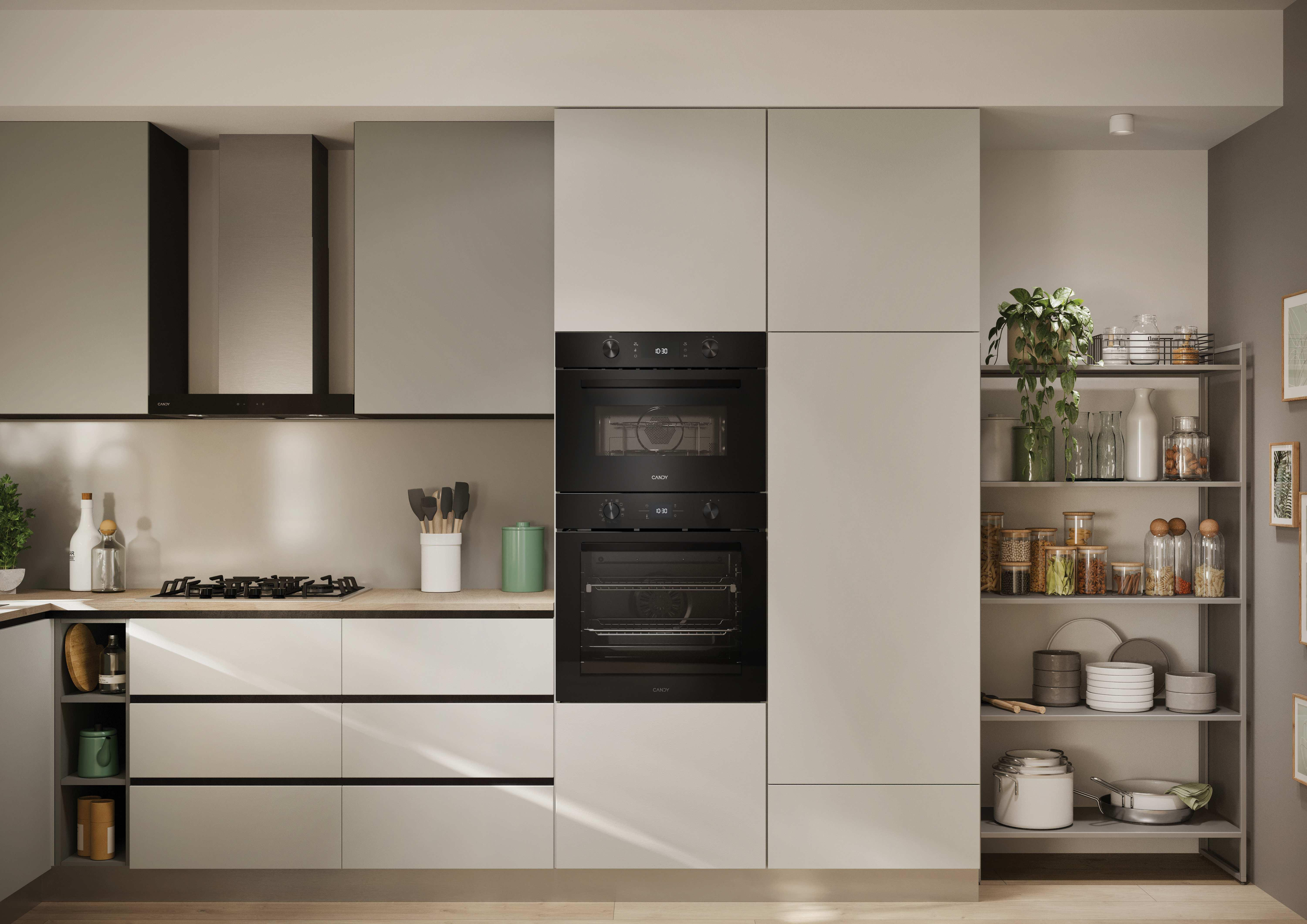 Una cucina moderna con due forni. I forni sono integrati nella parete. C'è una cappa aspirante.