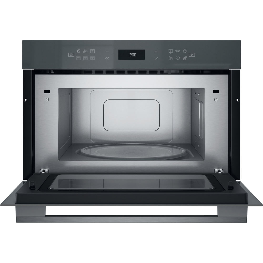 A grey microwave oven with an open door. The interior is visible. The time 12:00 is displayed.