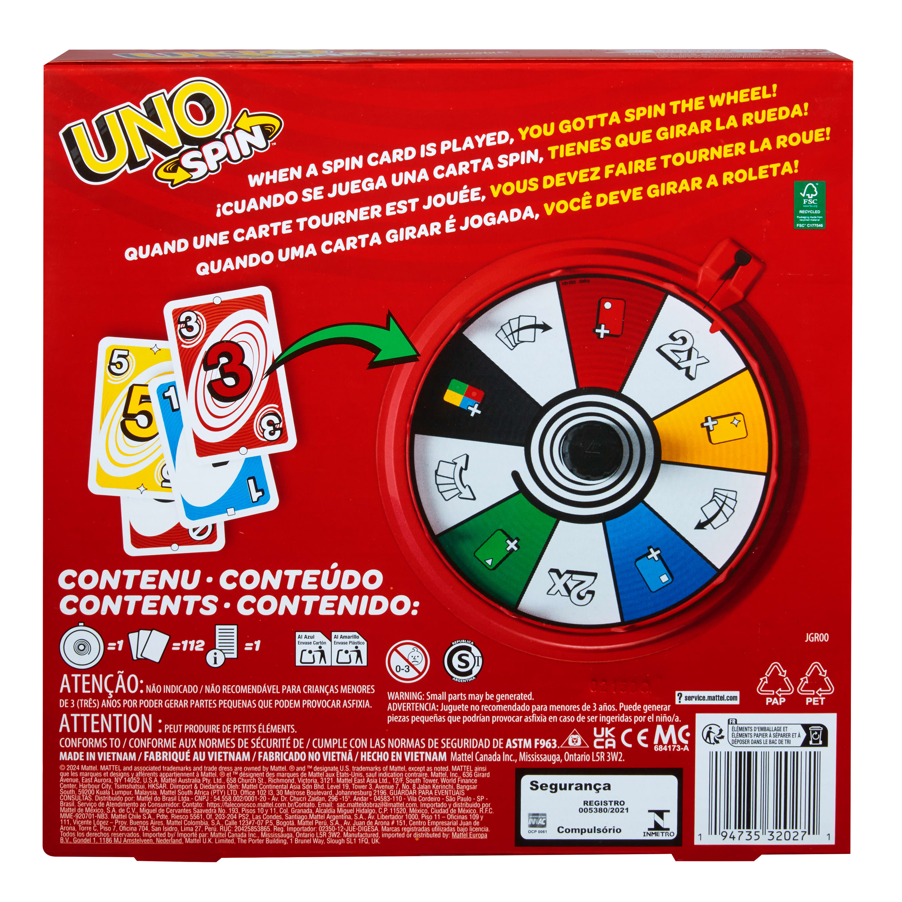 Boîte UNO Spin. Contient des cartes et une roue pivotante avec des instructions en plusieurs langues. Fond blanc.