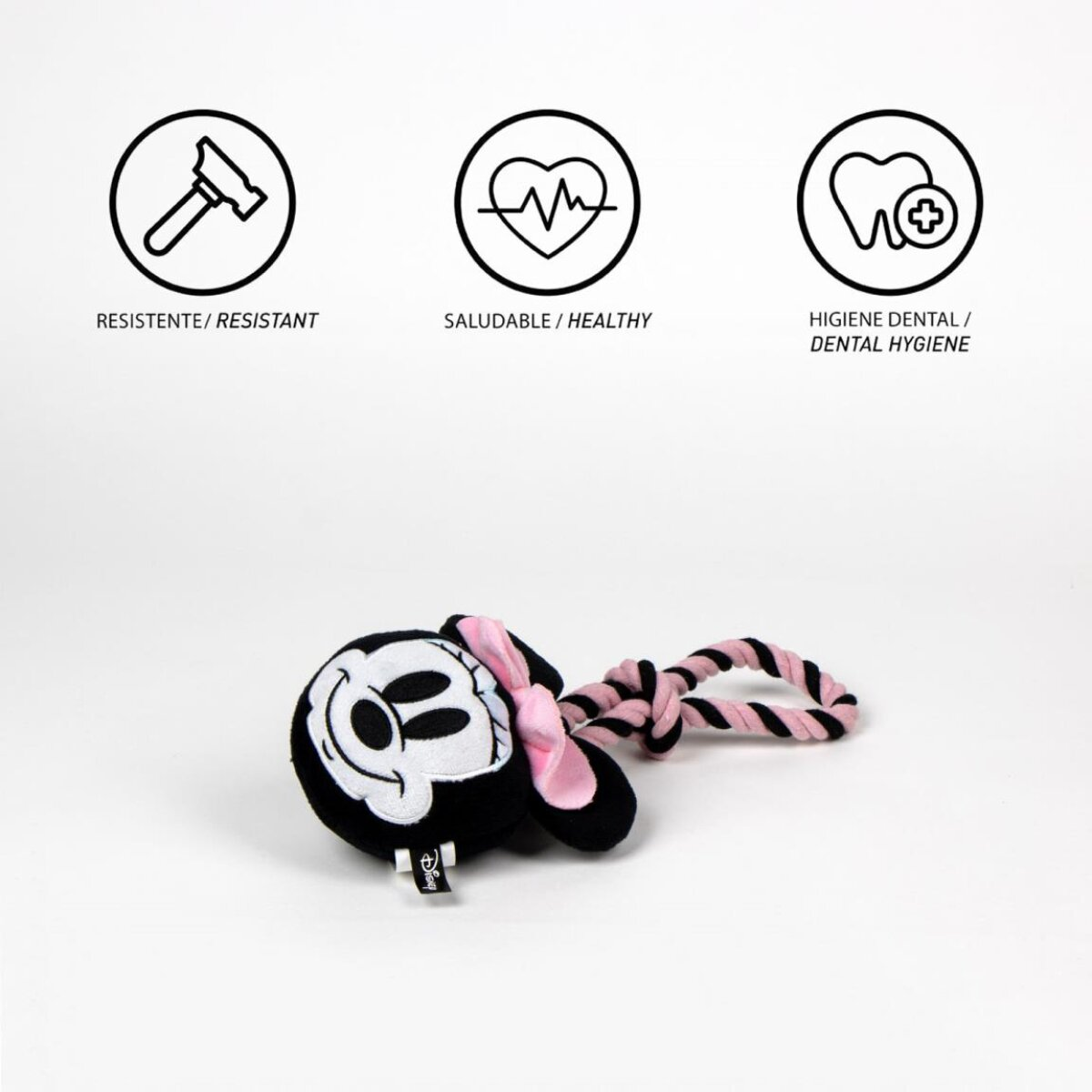 Ein Minnie Mouse Spielzeug mit rosa Schleife und Seil. Oben drei Symbole: Hammer, Herz und Zahn.