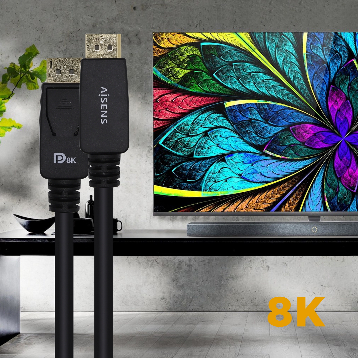 Dos cables DisplayPort negros con conectores. Imagen colorida de flor en un televisor al fondo.