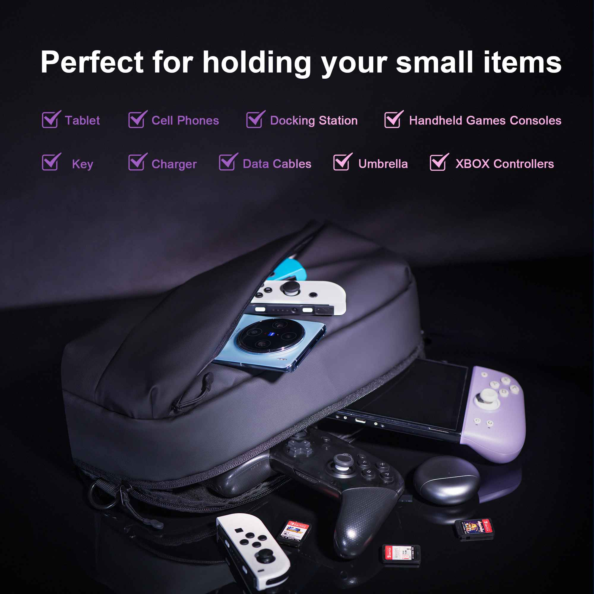 Eine schwarze Tasche mit verschiedenen Gegenständen: Tablet, Telefon, Ladegerät, Controller und Spielkassetten.