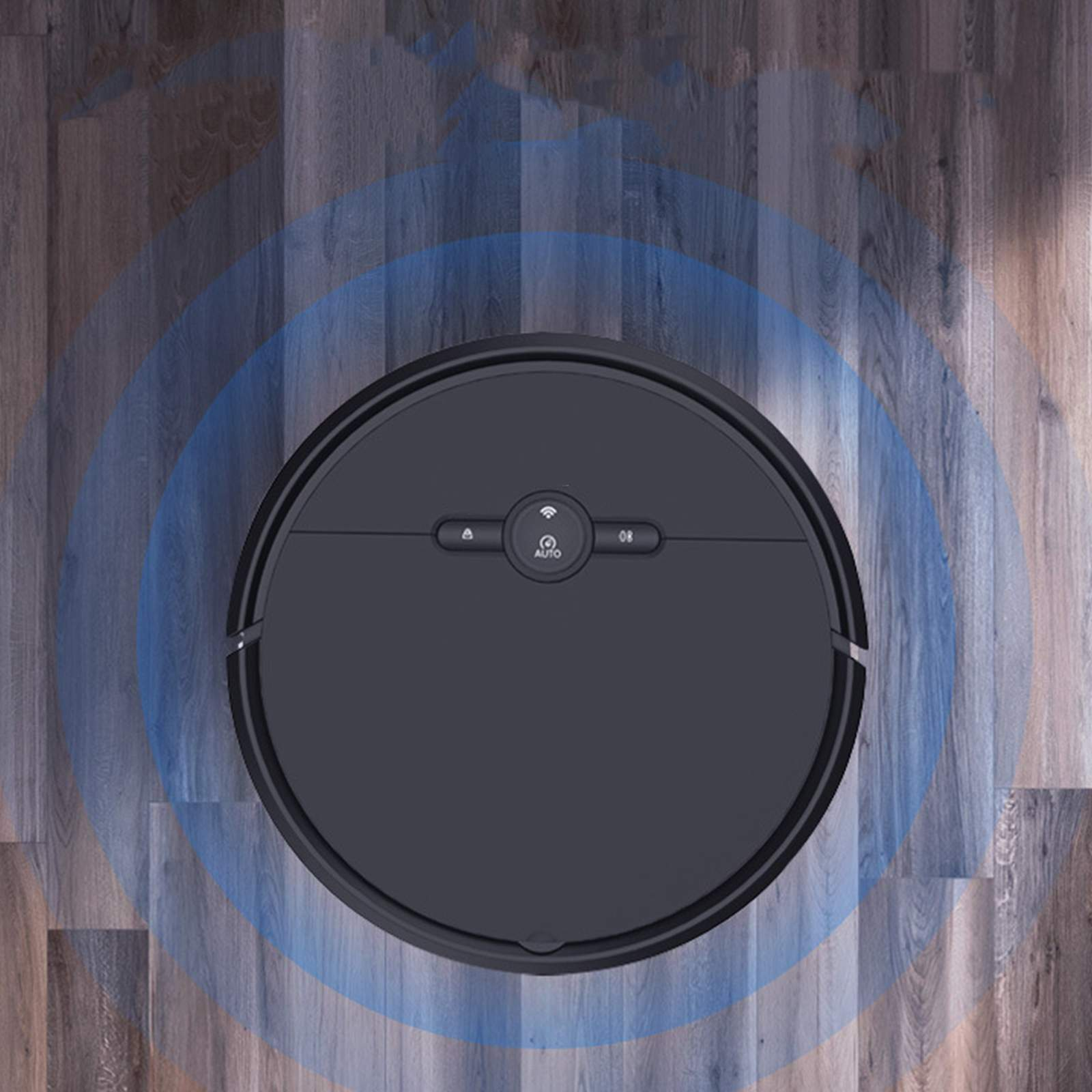 Ein schwarzer Roboter-Staubsauger auf einem Holzboden. Blaue Kreise um den Staubsauger zeigen seinen Reinigungsbereich an.