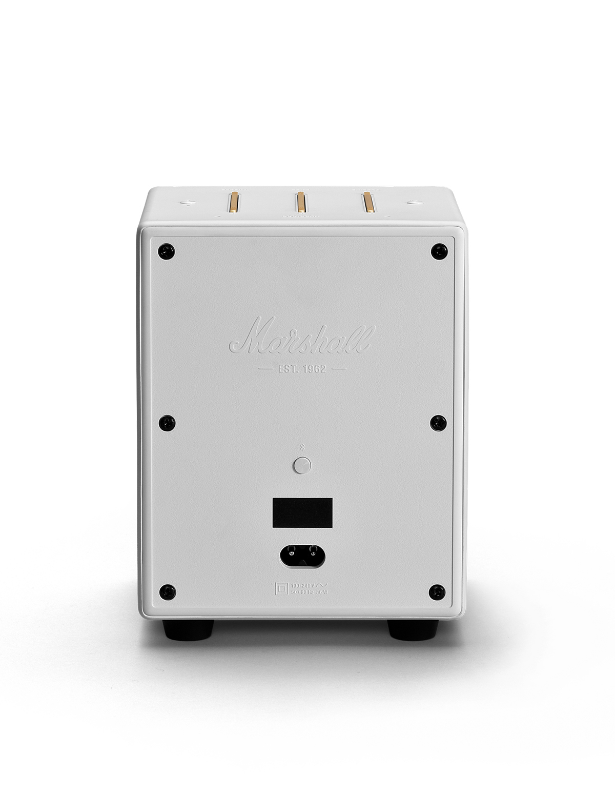 La parte trasera de un altavoz blanco con el logotipo de Marshall, puerto de alimentación y patas negras. Está sobre una superficie blanca.